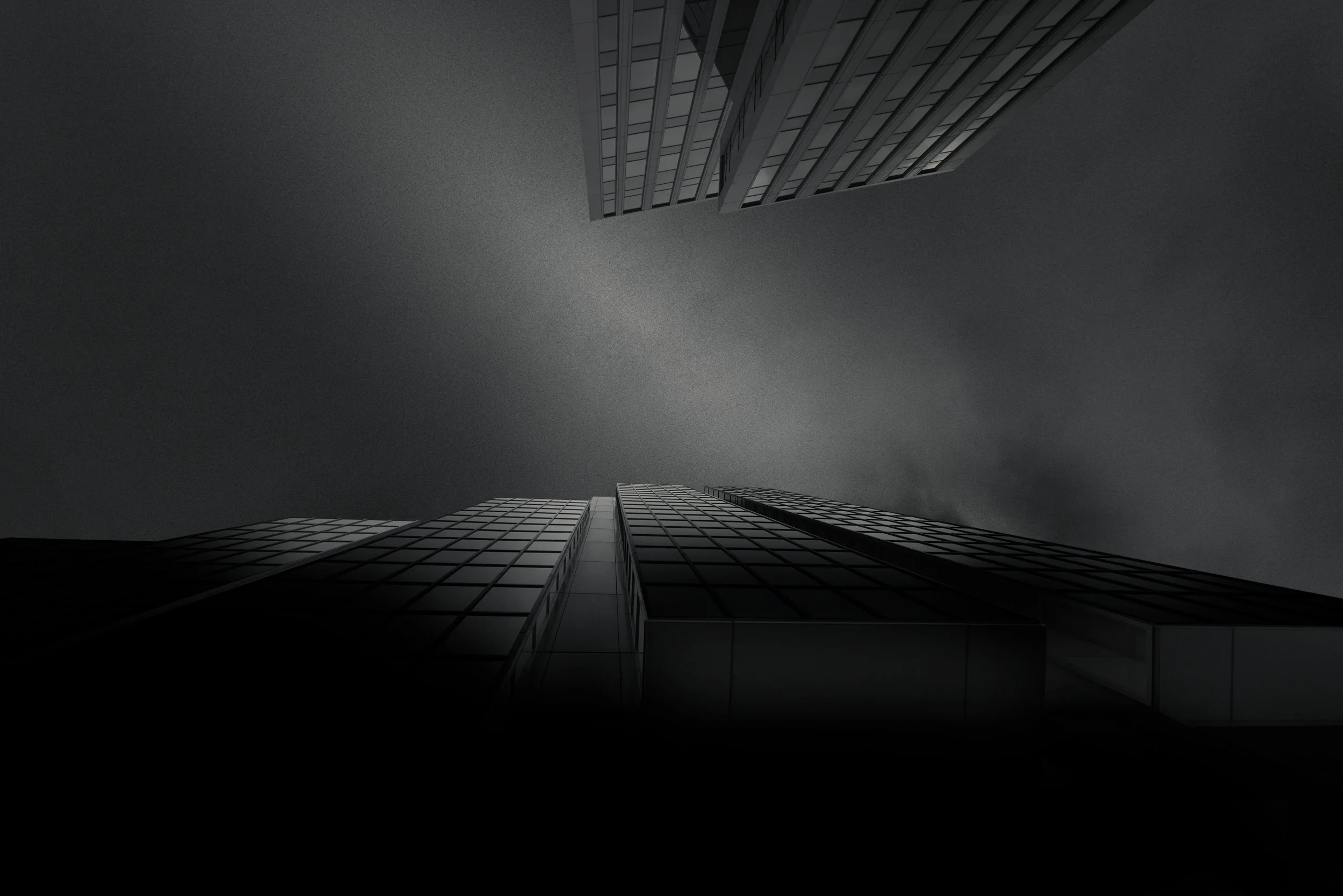 Contemporary corporate architecture on St Vincent Street, Glasgow: A dramatic monochromatic study of the city's financial district. This extreme low-angle architectural photograph captures the rhythmic grid patterns and reflective glass facades of mo