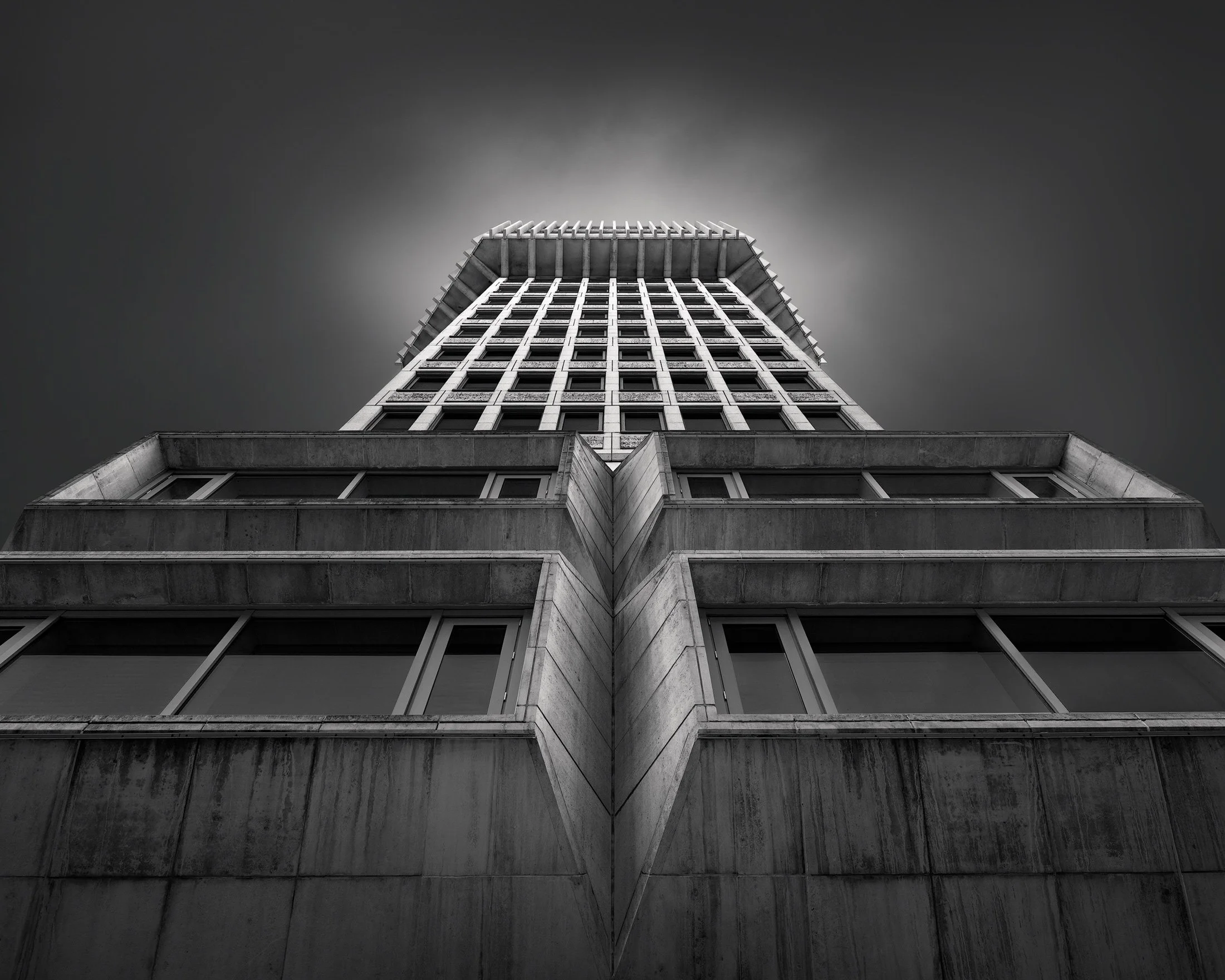 [architecture] [uk] [london] [blackandwhite] Ministry of Justice London upward monochrome, massive raw concrete Brutalist tower rising from a stepped podium. Architectural Photography by Jim Scott.