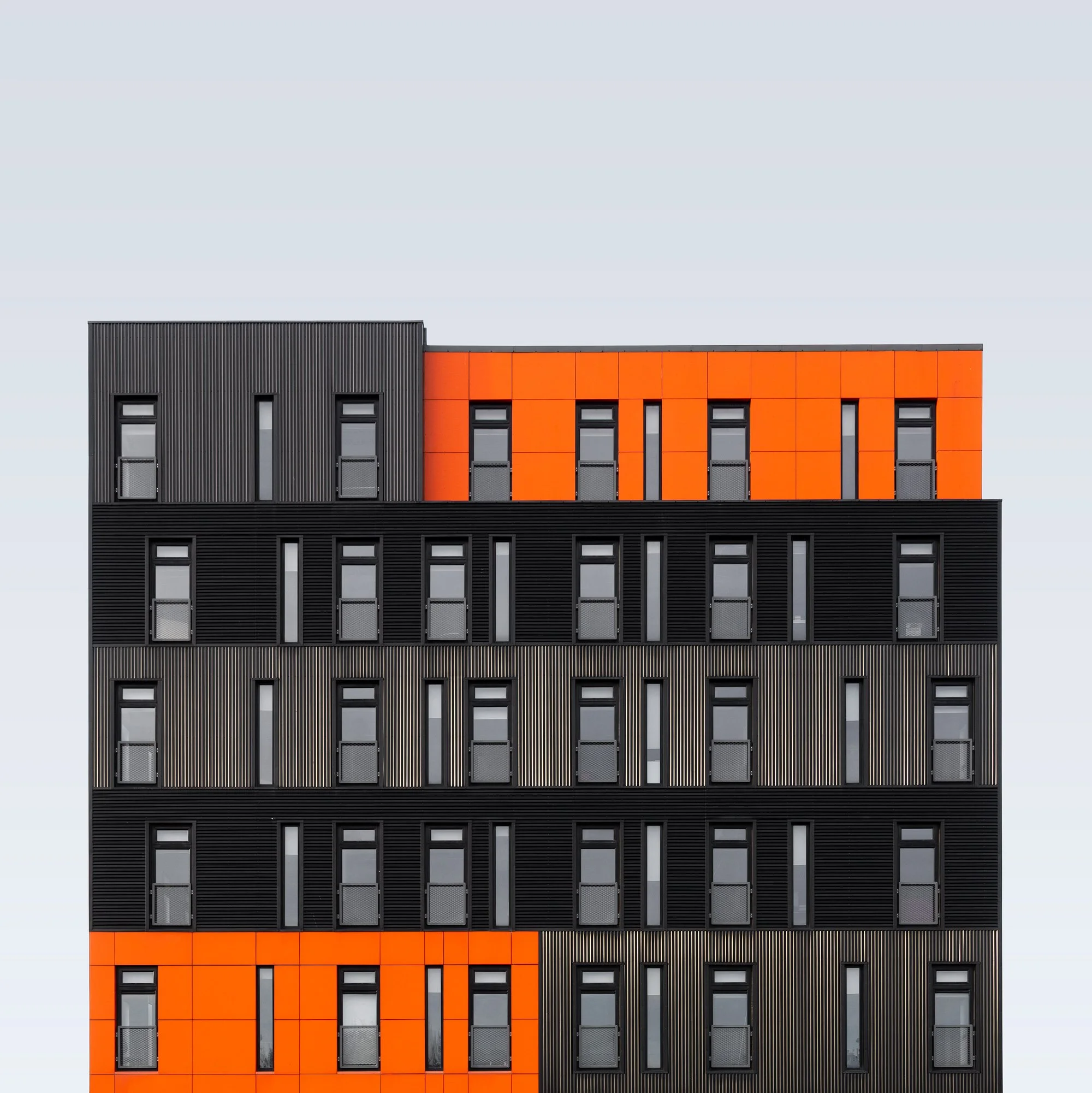 [architecture] [uk] [middlesbrough] [colour] Boho5 Middlesbrough digital technology hub, bold orange and black ribbed facade panels, striking colour contrast grid. Architectural Photography by Jim Scott.