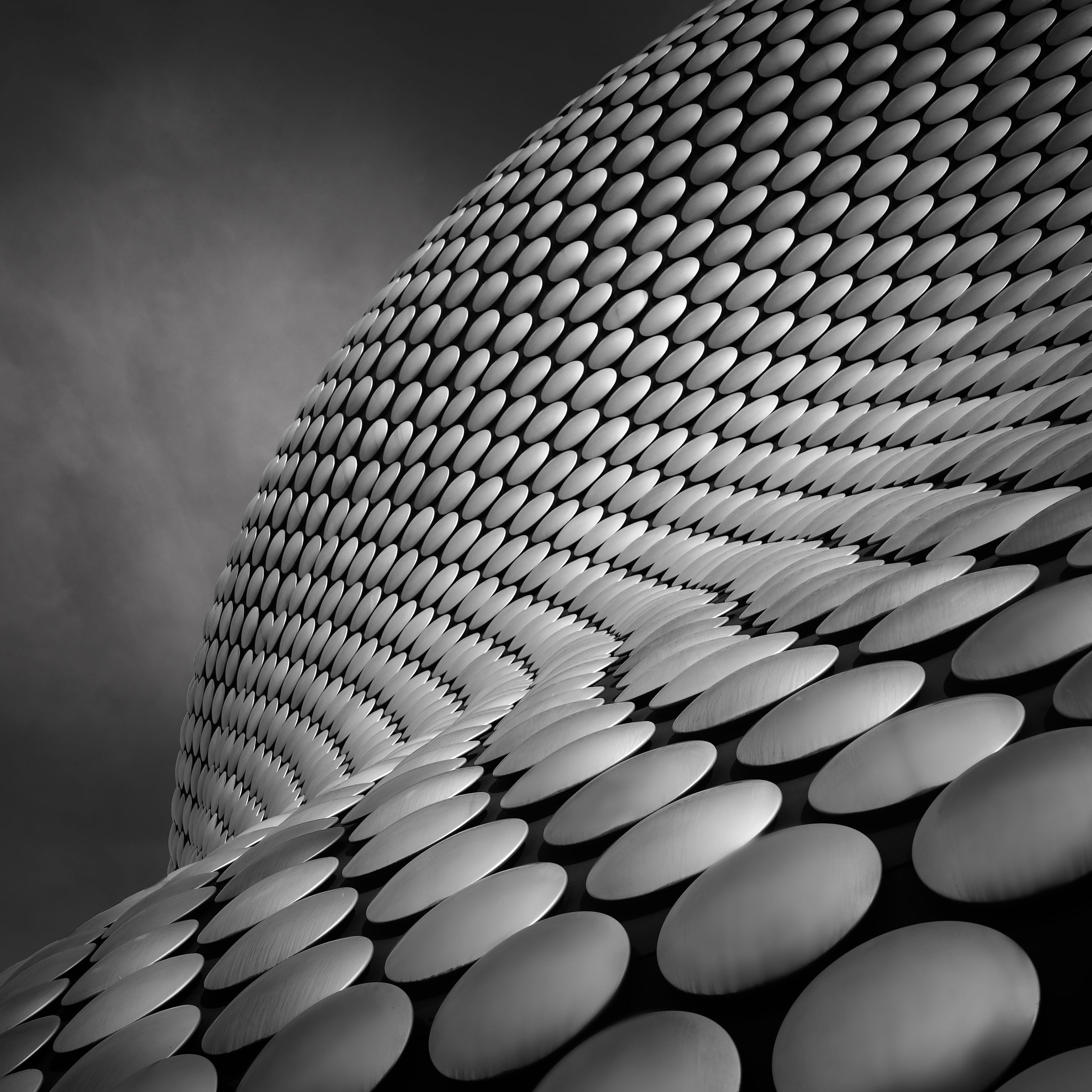 [architecture] [uk] [birmingham] [blackandwhite] [square] Selfridges Birmingham Bullring B&W close up with thousands of polished aluminium discs curving across the blob-form Architectural Photography by Jim Scott.