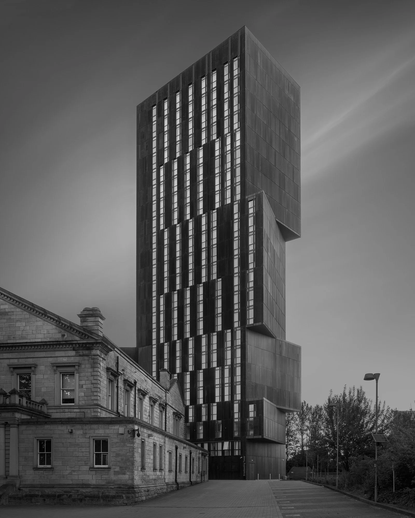 [architecture] [blackandwhite] [uk] [leeds] Monochrome long-exposure, Broadcasting Tower Leeds, Corten steel against sandstone, Woodhouse Lane. Architectural Photography by Jim Scott.