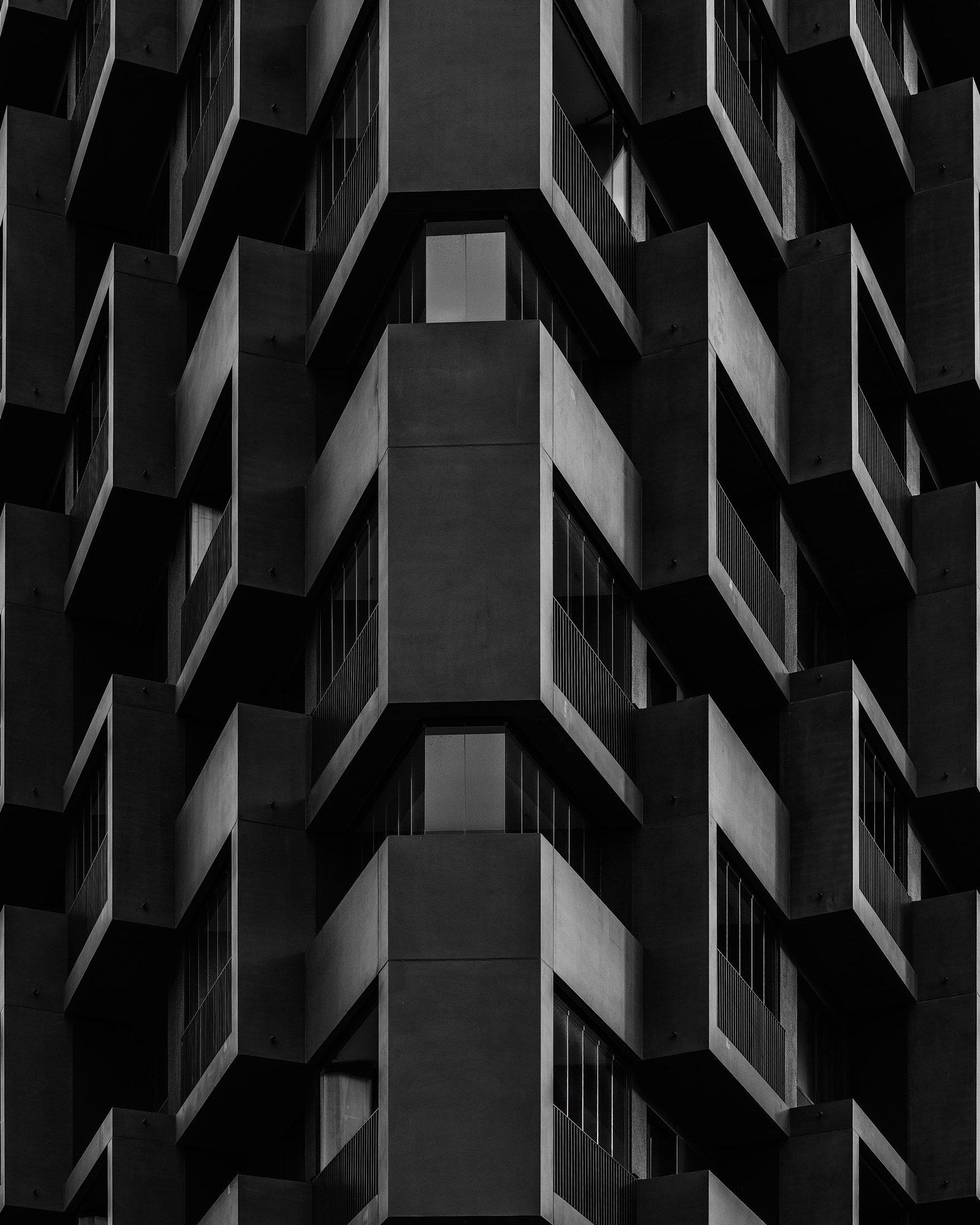 [architecture] [europe] [hamburg] [blackandwhite] [abstract] HafenCity Hamburg residential balcony facade, repeating geometric concrete forms, abstract close-up monochrome pattern. Architectural Photography by Jim Scott. 