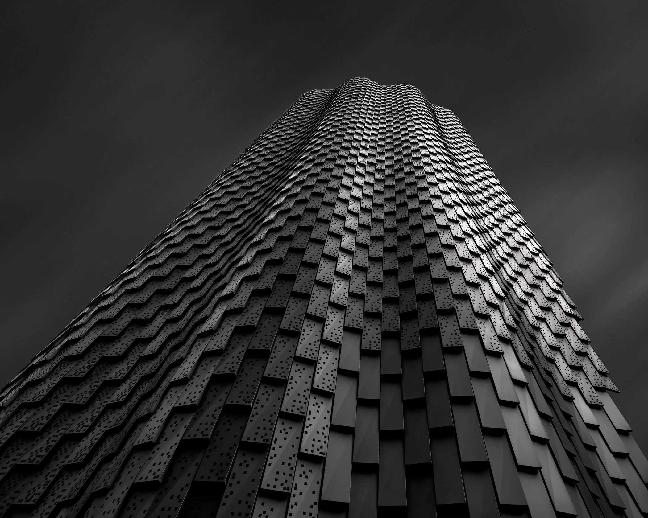 [architecture] [uk] [london] [blackandwhite] Broadgate Tower London dramatic upward study, scalloped dark metallic cladding tapering to a rounded apex. Architectural Photography by Jim Scott.