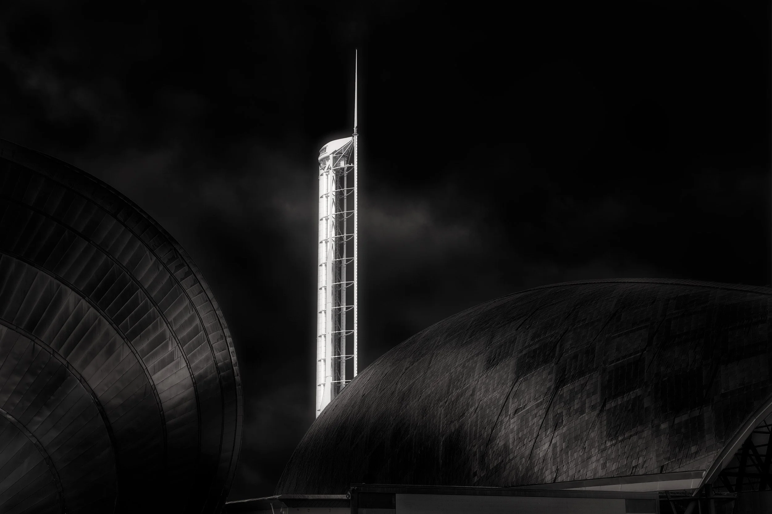 [architecture] [uk] [glasgow] [blackandwhite] Glasgow Science Centre Tower flanked by the metallic dome of the IMAX cinema and roof section of the Science Centre. Architectural Photography by Jim Scott