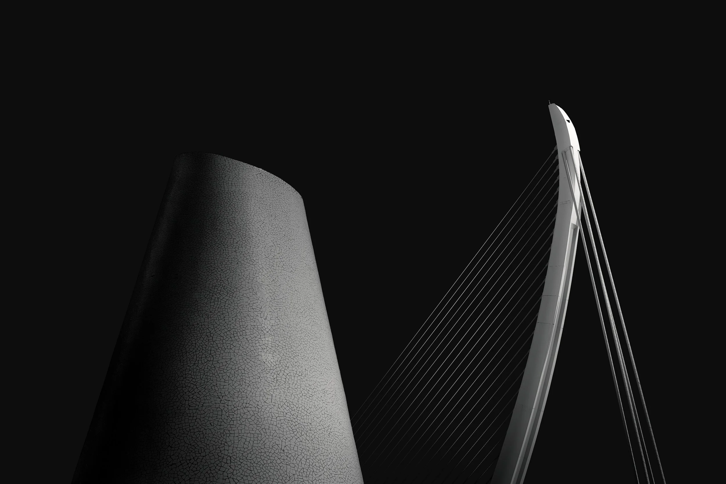 [architecture] [europe] [valencia] [blackandwhite] Assut de l'Or Bridge Valencia, cable-stayed pylon beside crackled ceramic ventilation tower, minimalist black and white. Architectural Photography by Jim Scott.