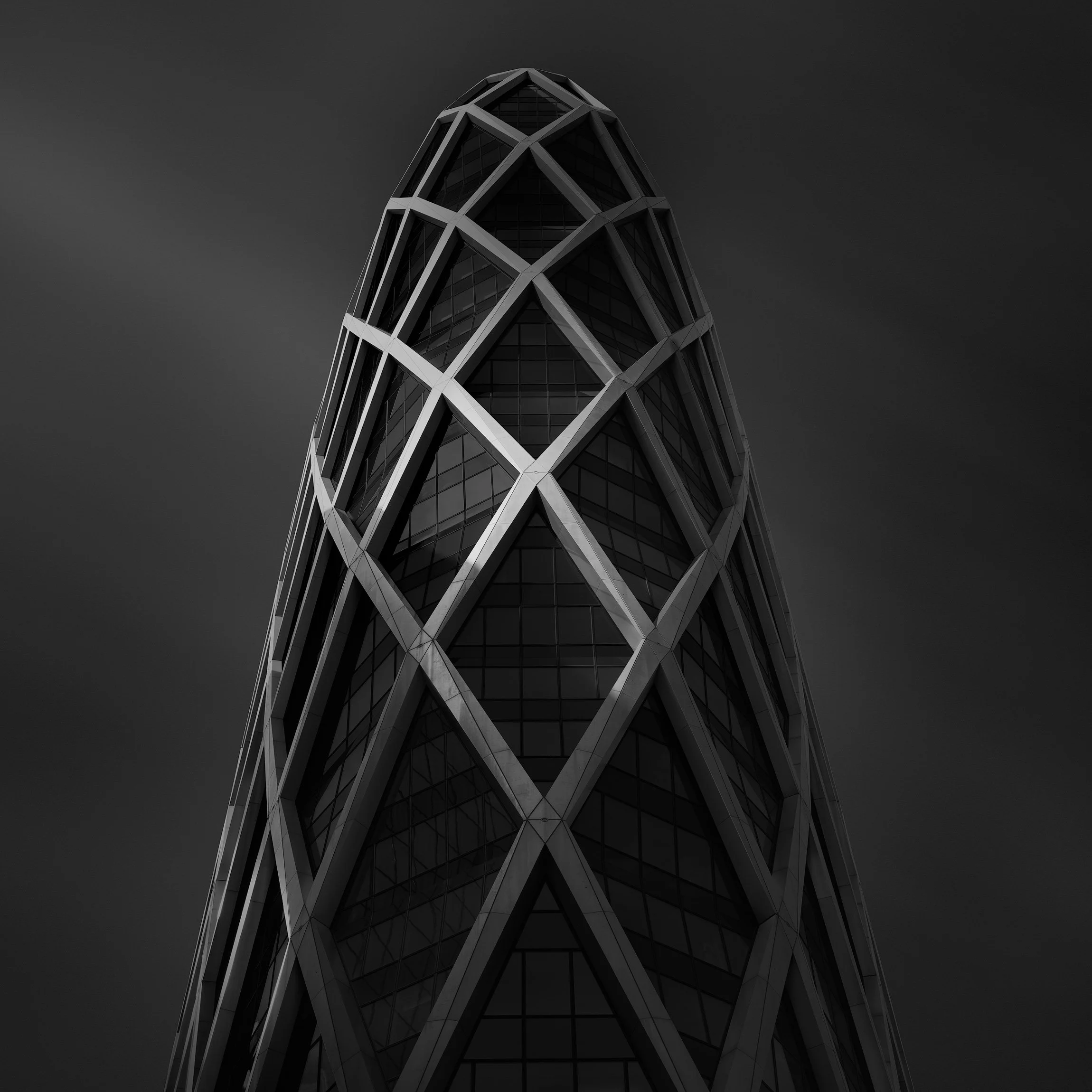 [architecture] [europe] [paris] [blackandwhite] [square] D2 Tower La Defense Paris upward study, aluminium diagrid exoskeleton tapering to a sharp triangular apex. Architectural Photography by Jim Scott.