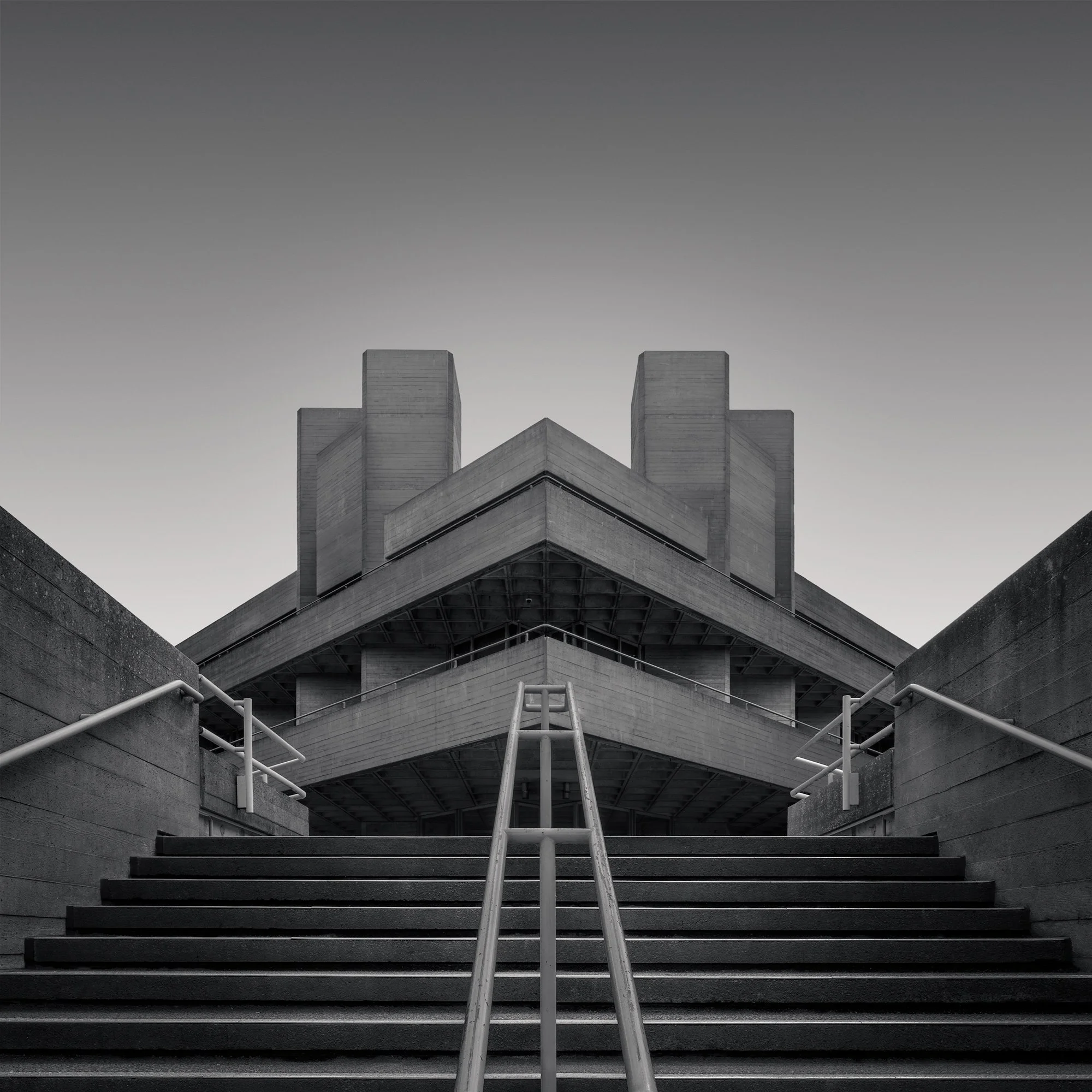 [architecture] [uk] [london] [blackandwhite] [square] National Theatre London, Lasdun brutalist concrete symmetry, stepped terraces and angular towers, perfectly centred black and white. Architectural Photography by Jim Scott.
