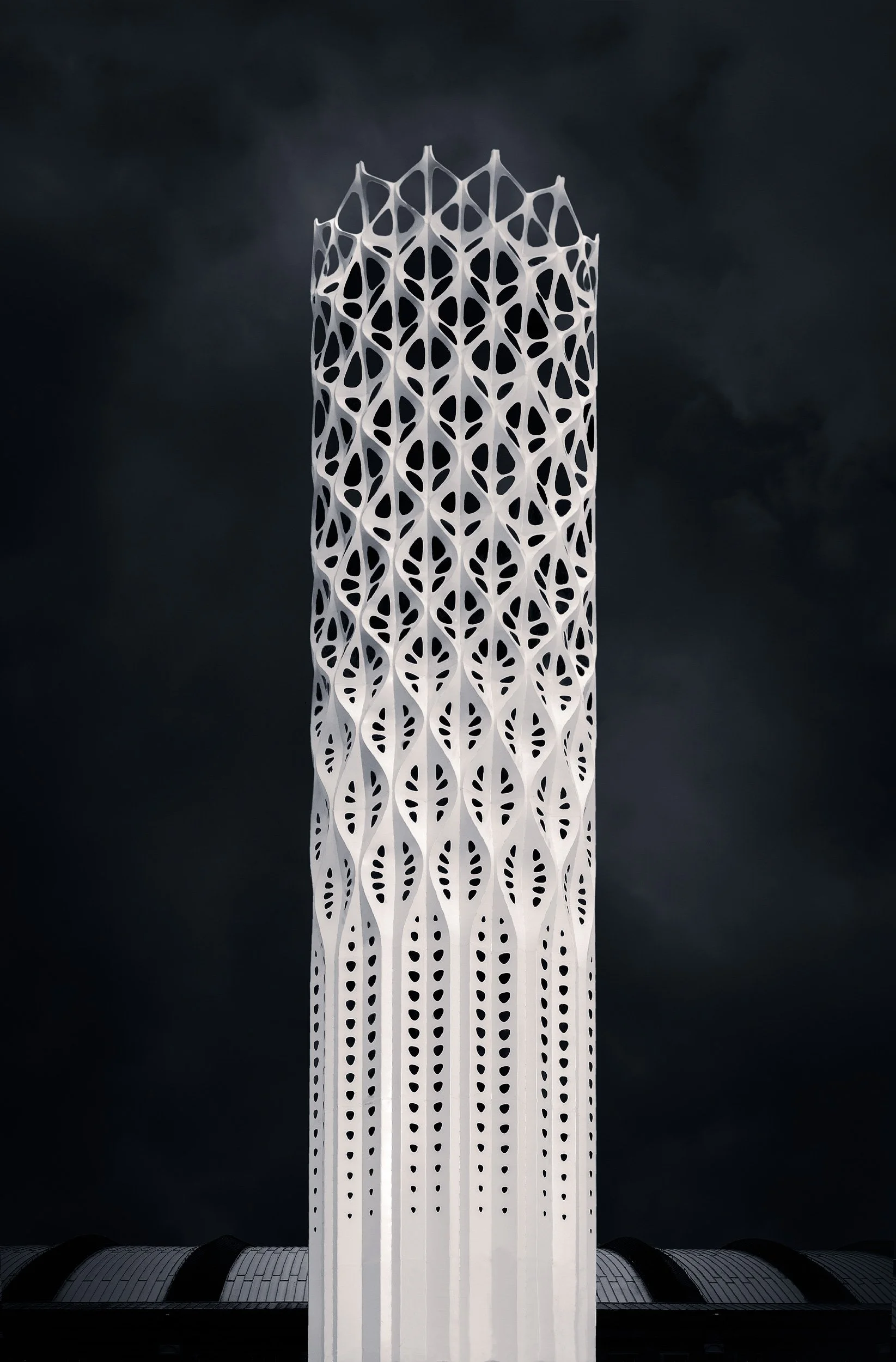 Biomimetic infrastructure in Manchester, UK: A dramatic monochromatic study of the Tower of Light, designed by Tonkin Liu. This vertical architectural photograph captures the tower’s intricate "Shell-lace" structure and laser-cut stainless steel skin