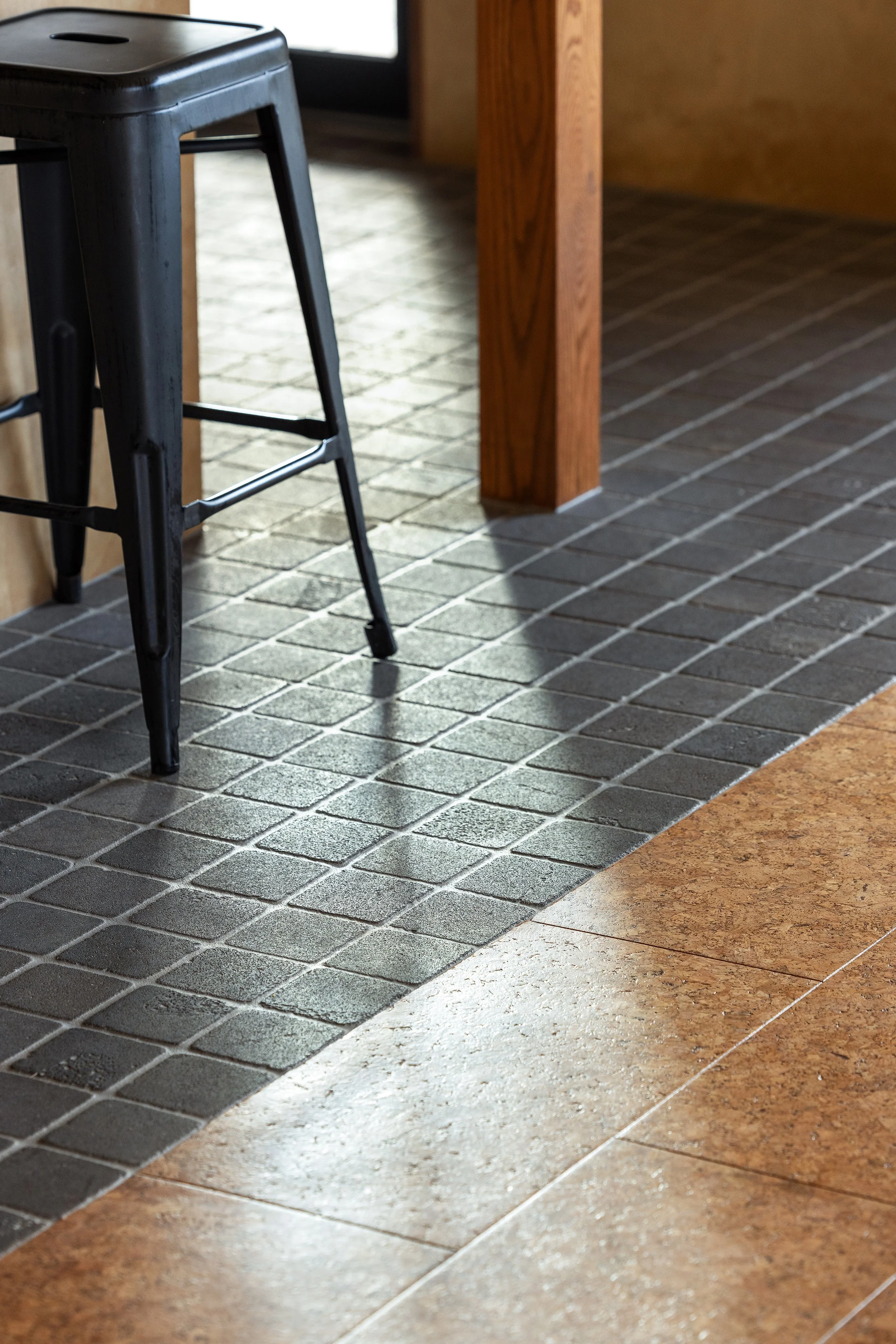Contemporary interior finishes blending timber supports with modern flooring in a Warrnambool heritage renovation. Bamstone tiles