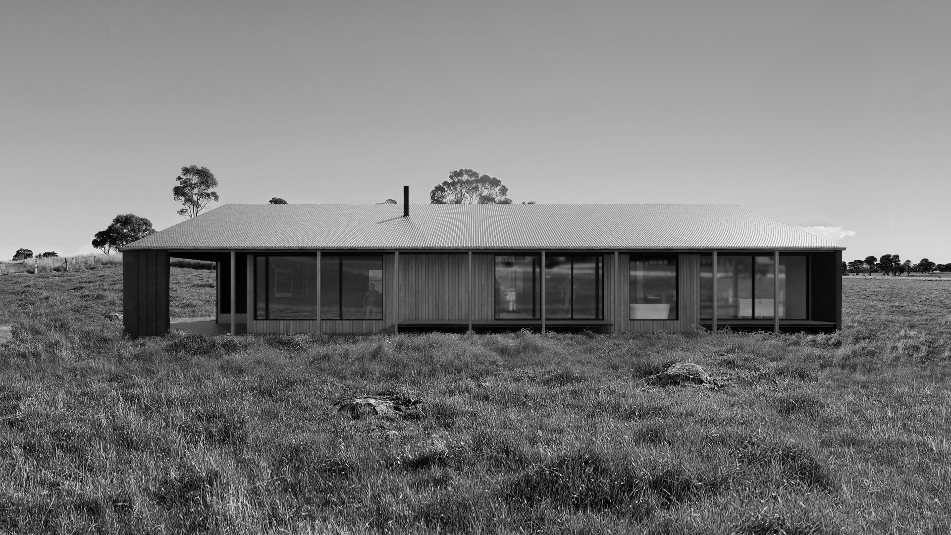 Black and white architectural photography of a sustainable rural home in Wangoom. Features a single-storey design with expansive glazing, connecting the modern residence to the Surf Coast landscape near Port Fairy.