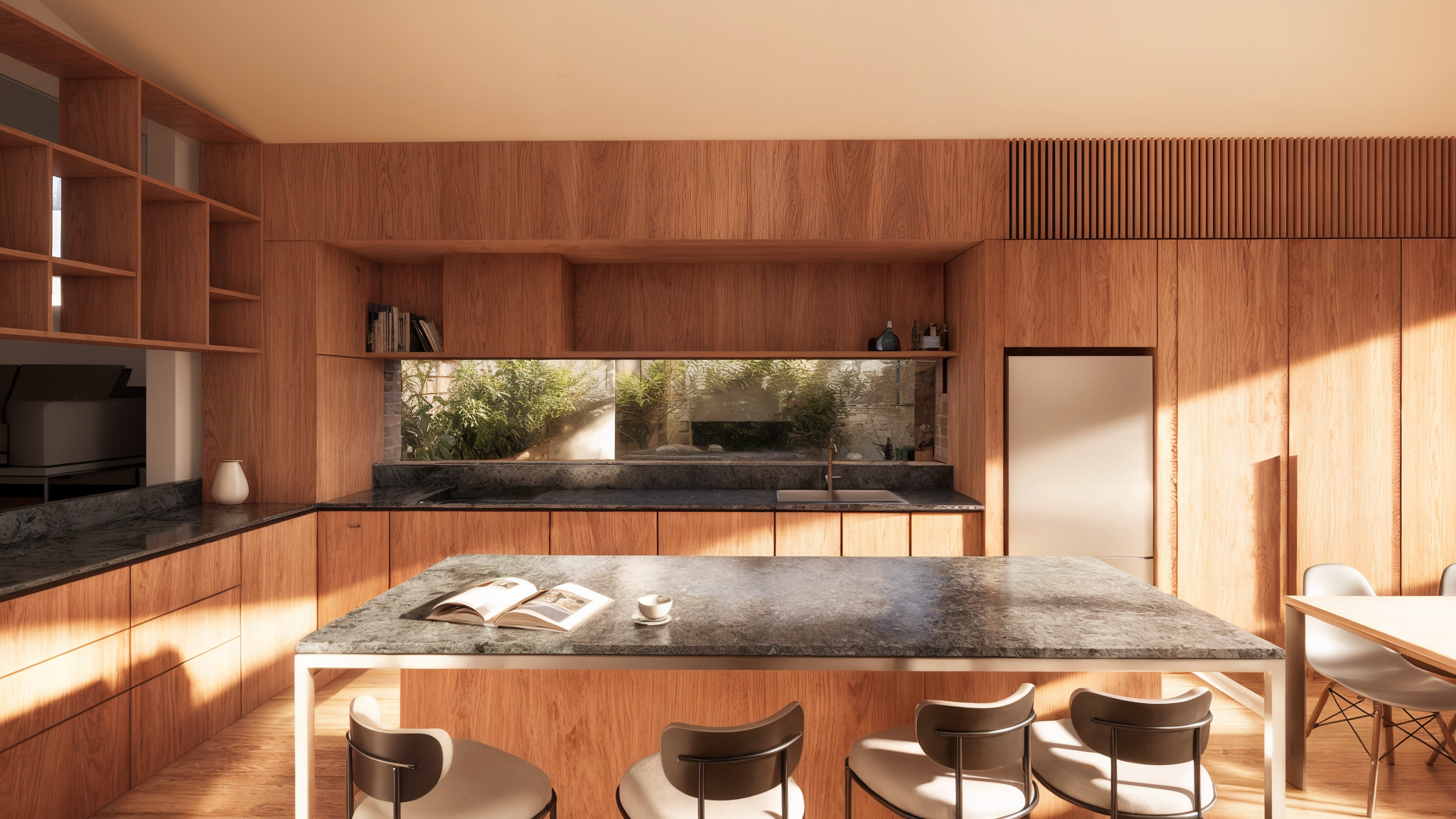 Modern kitchen design within a heritage renovation in Warrnambool. Features timber cabinetry, black marble countertops, and a sun-lit island, reflecting the coastal aesthetic of Port Fairy and the Great Ocean Road
