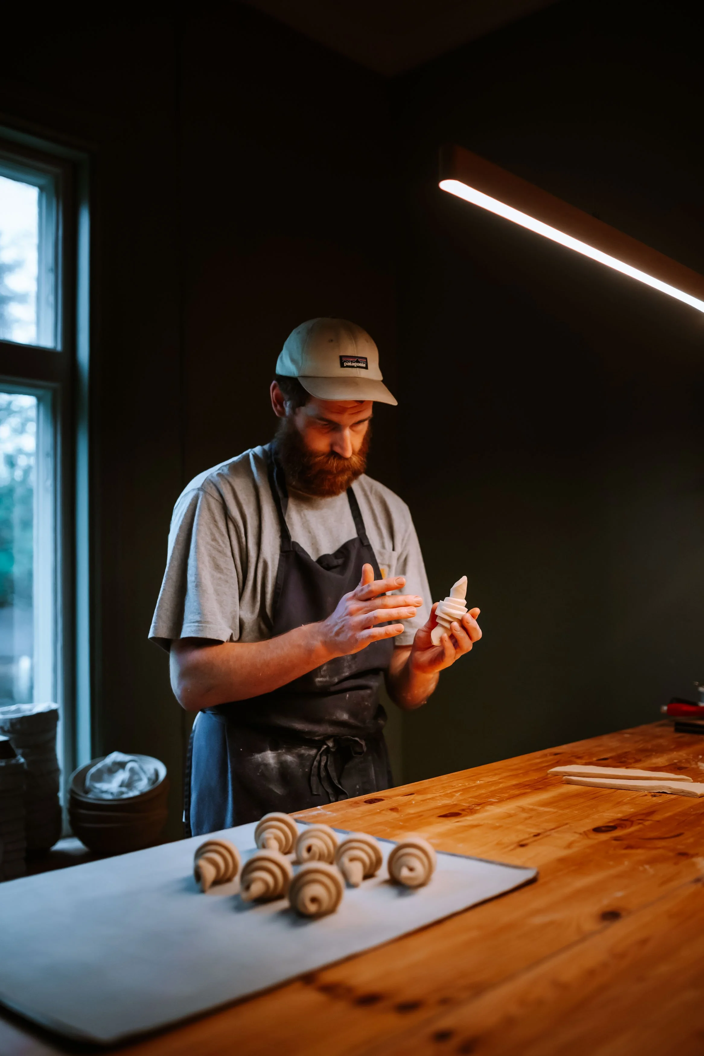 Baker making croissants during the fikabread course at Turistgården