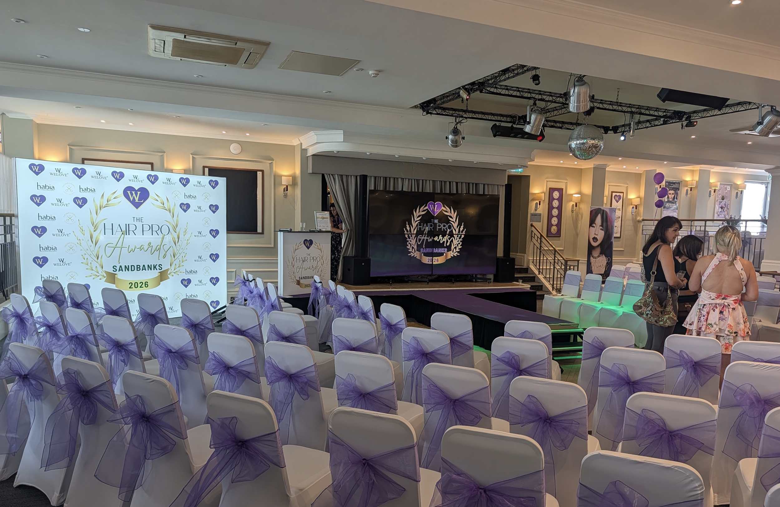 Wide angle shot of the event dressed and designed to echo the dedication and passion of the WELOVE brand.