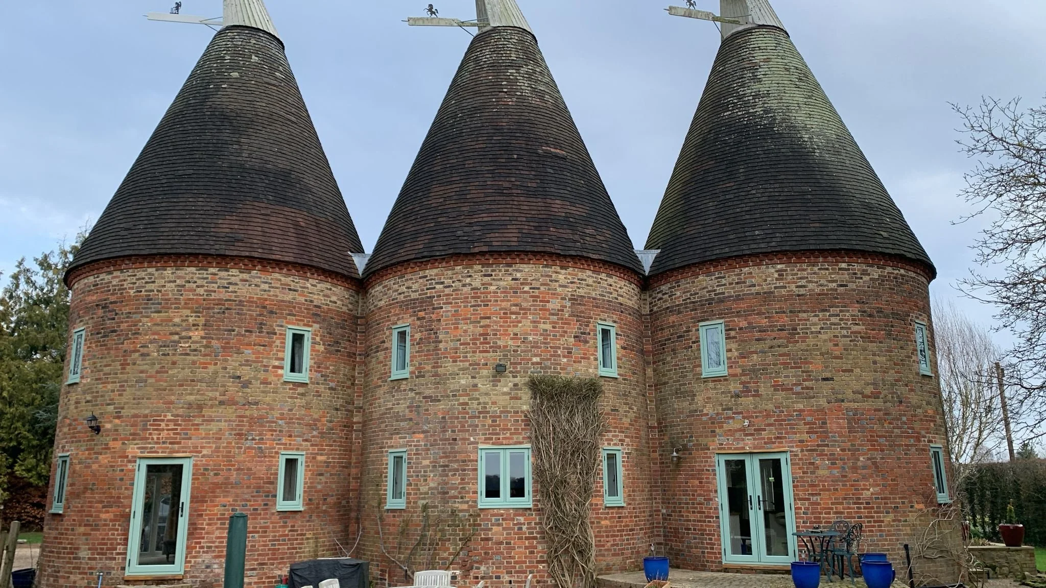 Quirky house with green timber effect windows
