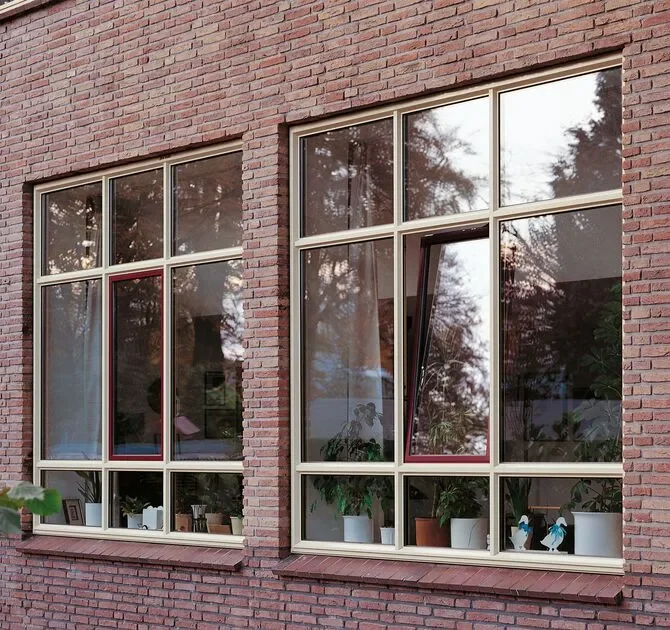 cream coloured aluminium window profiles take outside of a home