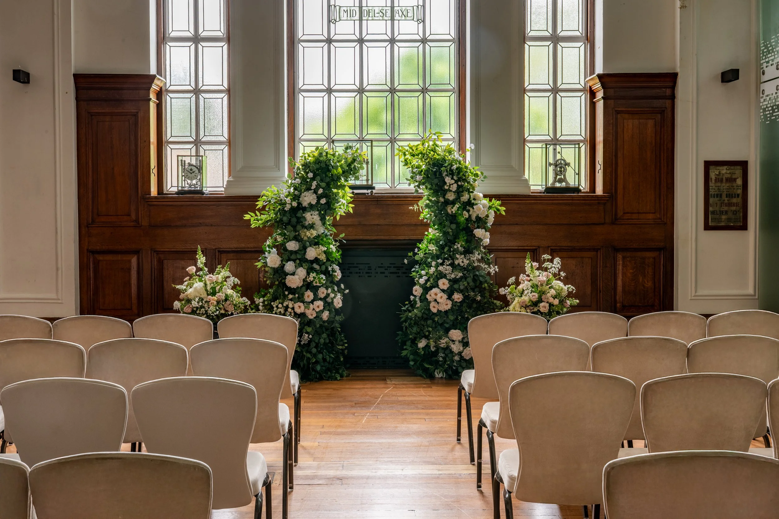 De Montfort Suite smal Ceremony flower arch london.jpg