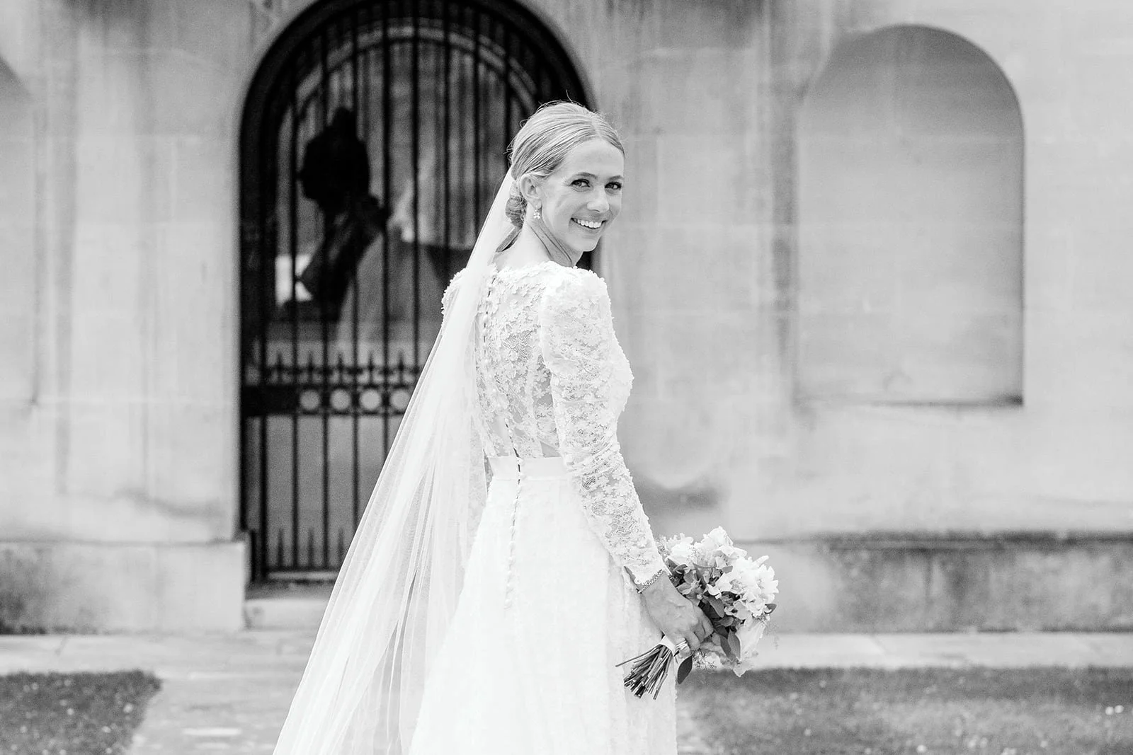 Bride portrait at Chiswick House & Gardens, holding a soft white and blue wedding bouquet.