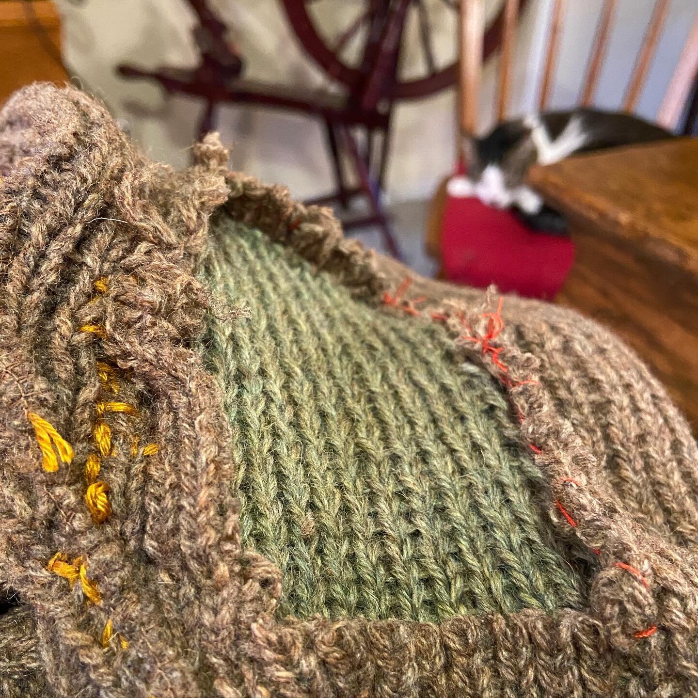 working on a big mend. it is a vintage pendleton sweater, very well-loved and well-worn by a member of my community of friends. it has about a dozen quarter-sized holes all over it plus enormous holes at the elbows and armpits. the mend is nearing co