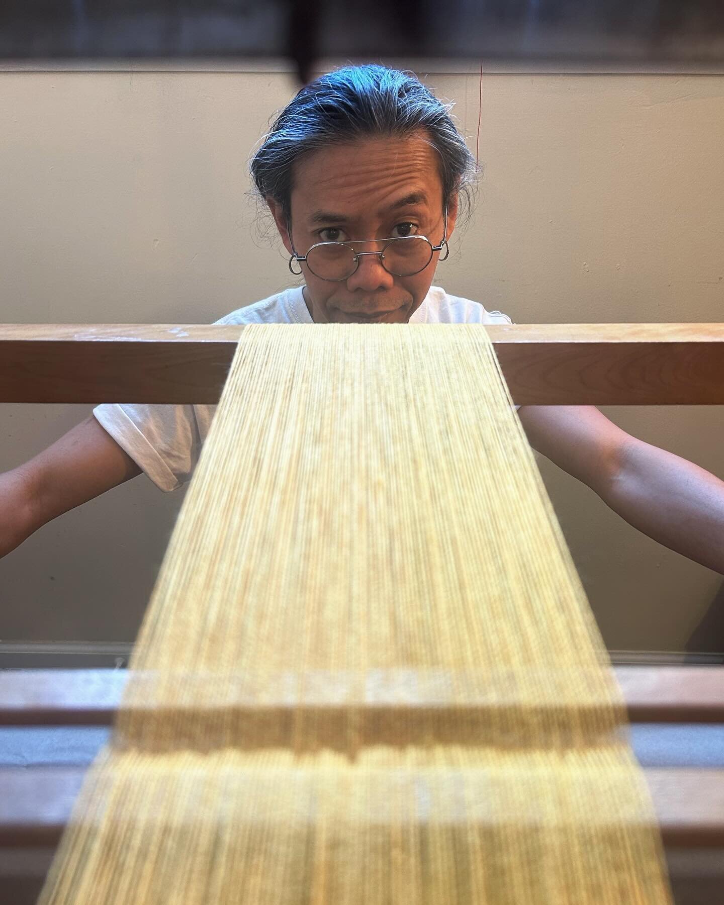 caught in the act!! of beaming 
#weavingassistant #yarnhusband #textiles 
#textileart #weaving #loom #yarn #fiber #wool 
#handsomeguy