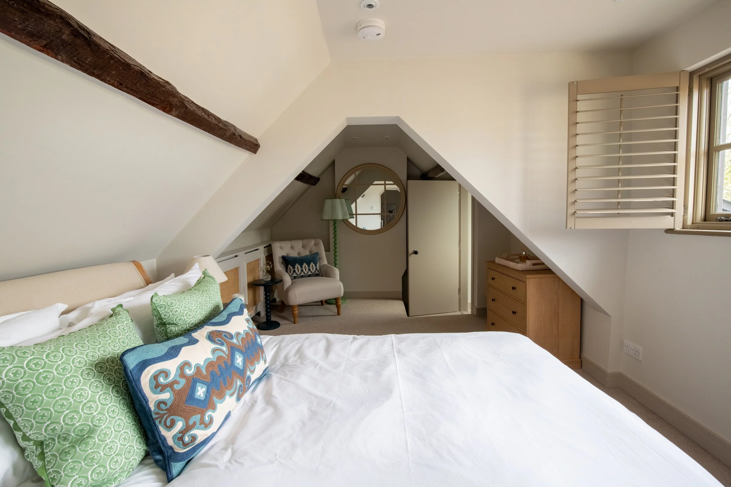 Master bedroom in the eaves with bed decoration beautiful accessories 