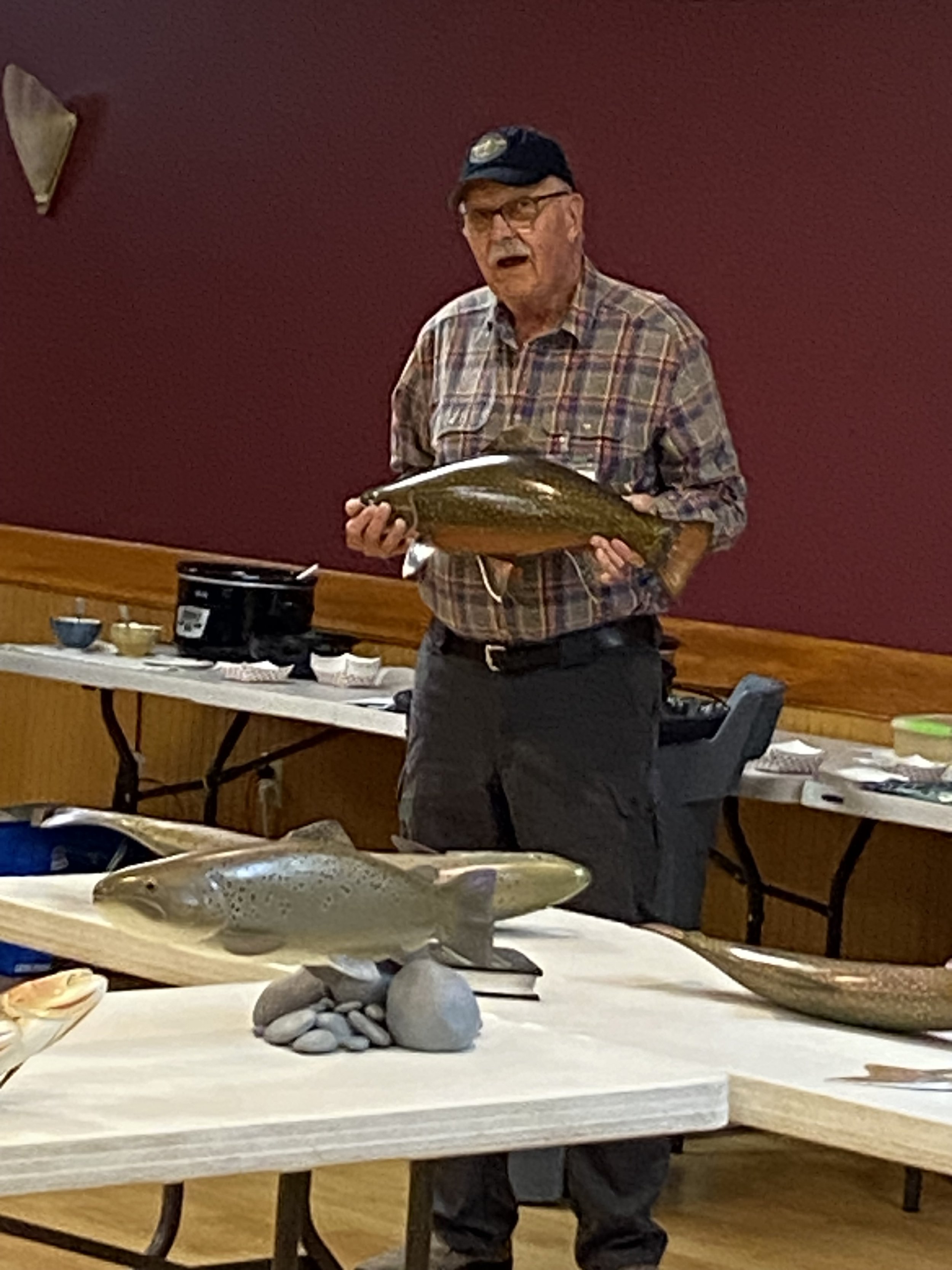 Joe Swaluk, a well known commissioned wood carver of game fish, brought a number of specimens he has caught, released, carved and hand painted from Alaska to Chile.
