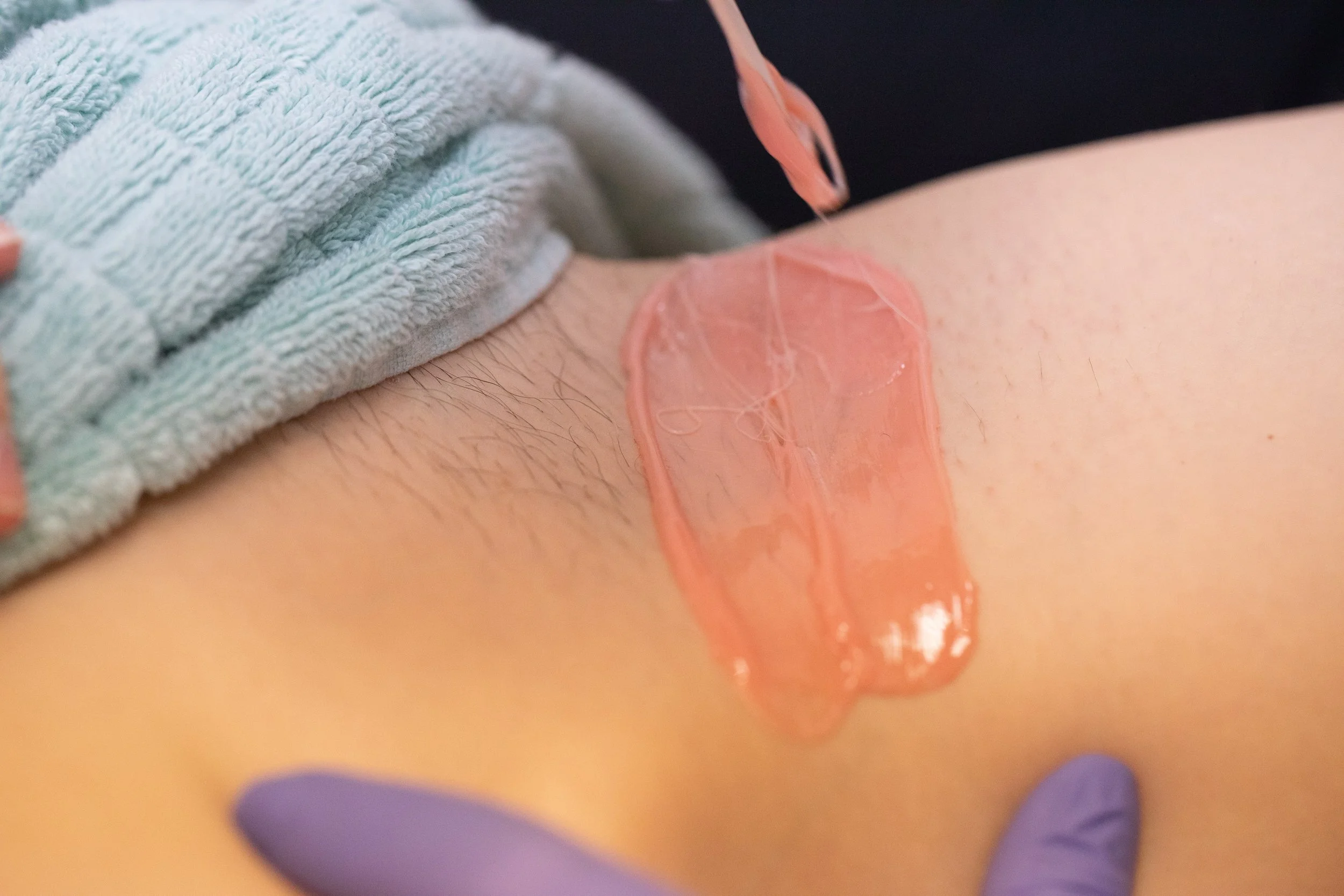 Body waxing treatment with soft wax application for smooth, longer-lasting hair removal results
