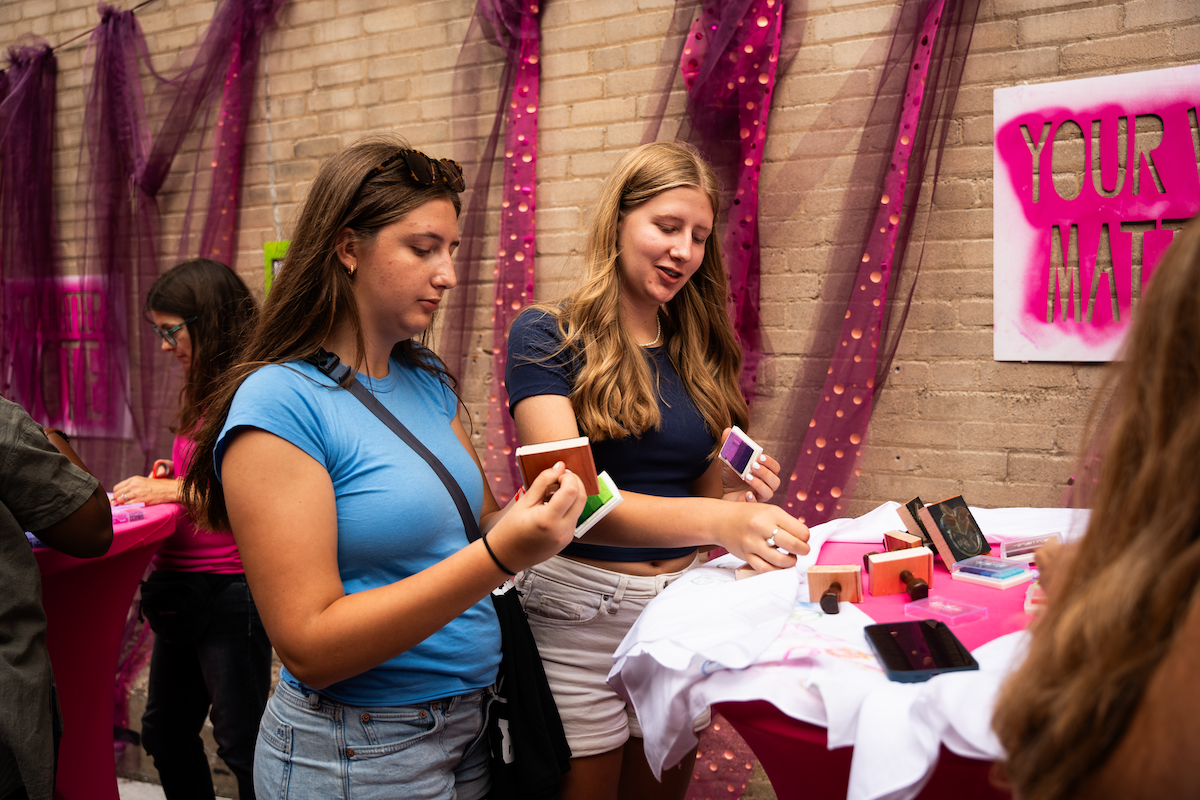 Attendees use stamps at a 'Your Vote Matters' alley activation produced by NEWaukee