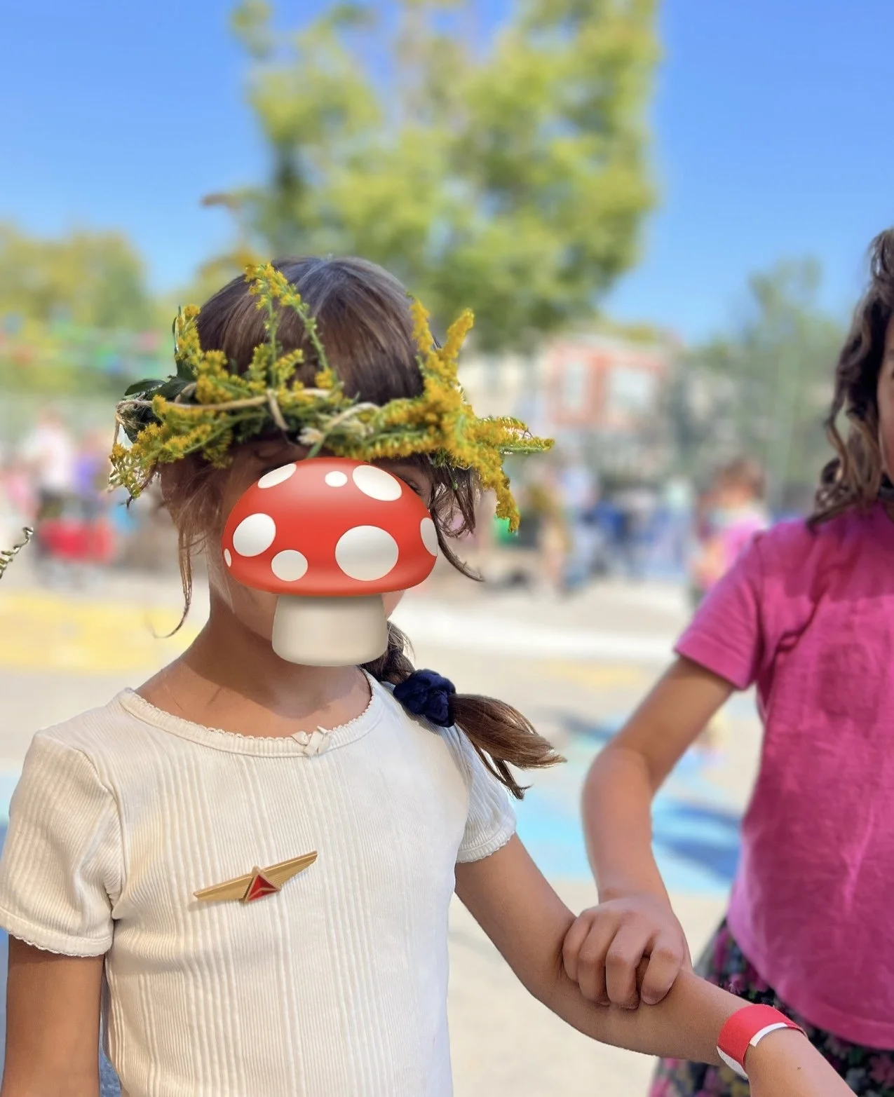 Green magic kid with her goldenrod flower crown. 