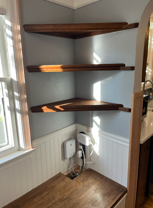 Removable panel conceals electronics and allows easy access. Material complements client's Mission Revival furnishings.