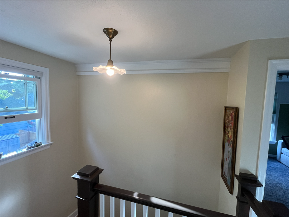 Fully custom molding profile complements existing trim proportions and sight lines. Carefully installed over lath and plaster.