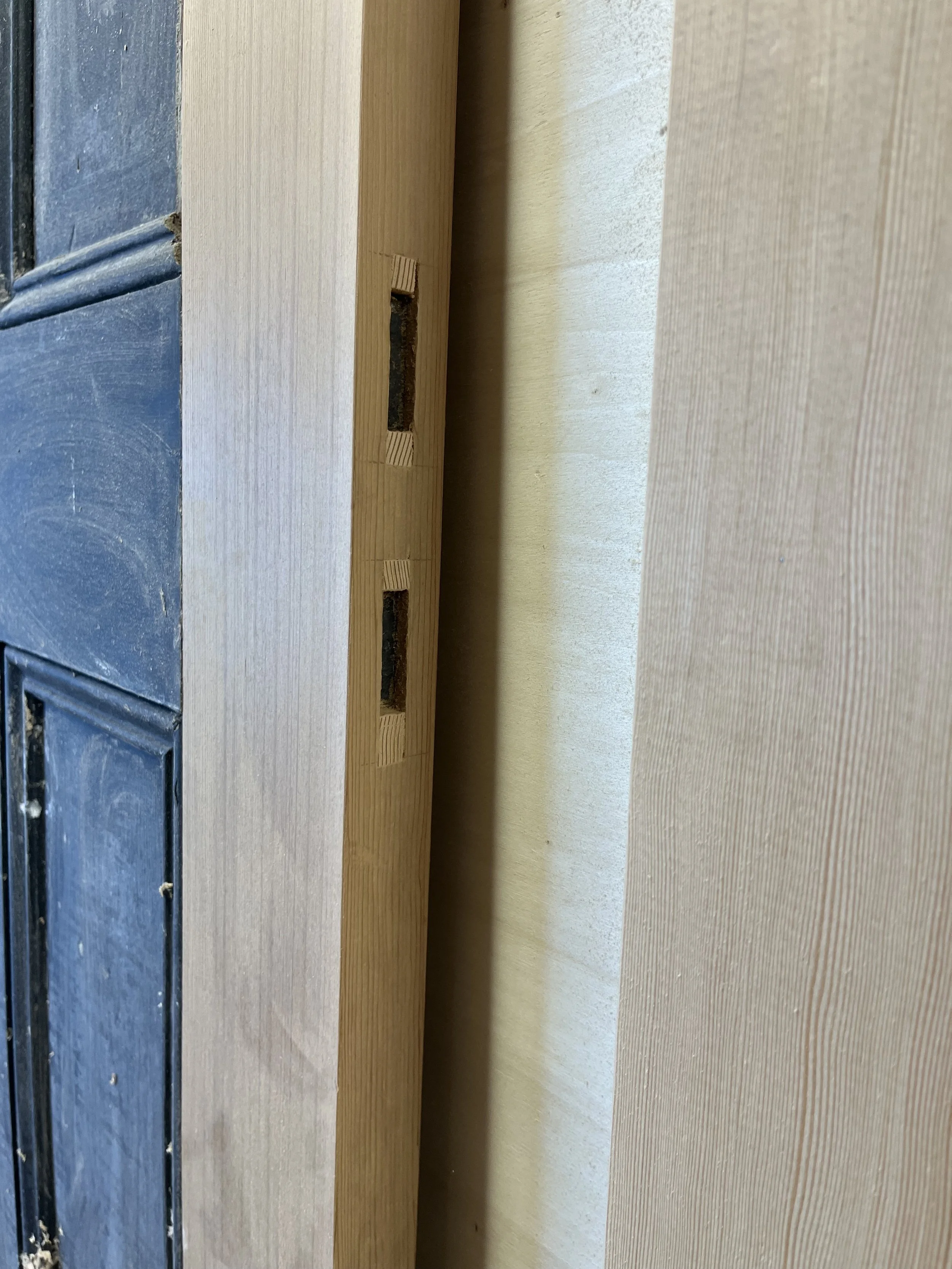 Replacement wedged through-mortised cedar stile on Victorian four-panel door