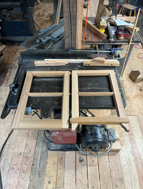 Reproduction cedar double-hung sash window. Traditional single-glazed window construction.