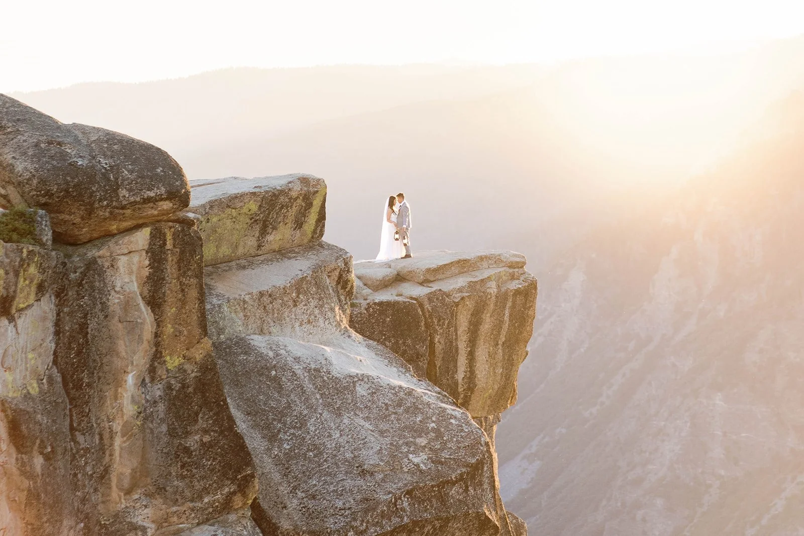 Bride and groom at sunrise at Taft Point