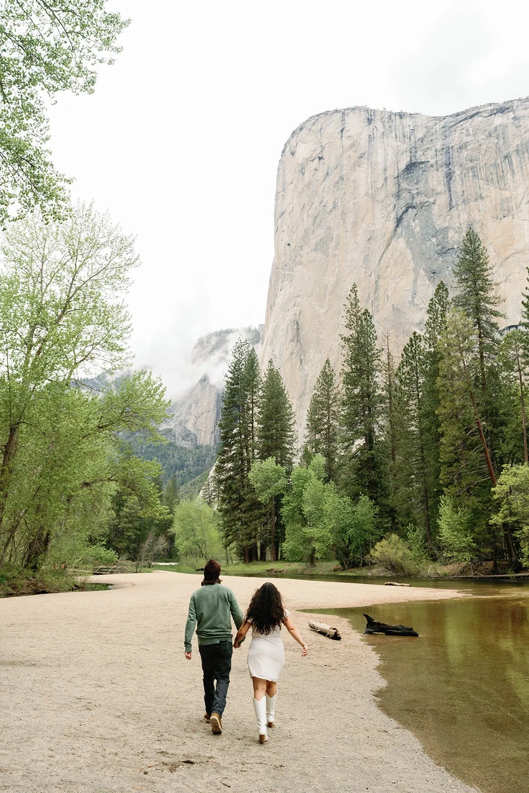 man-and-woman-at-cathedral-beach-engagement-photos.jpg