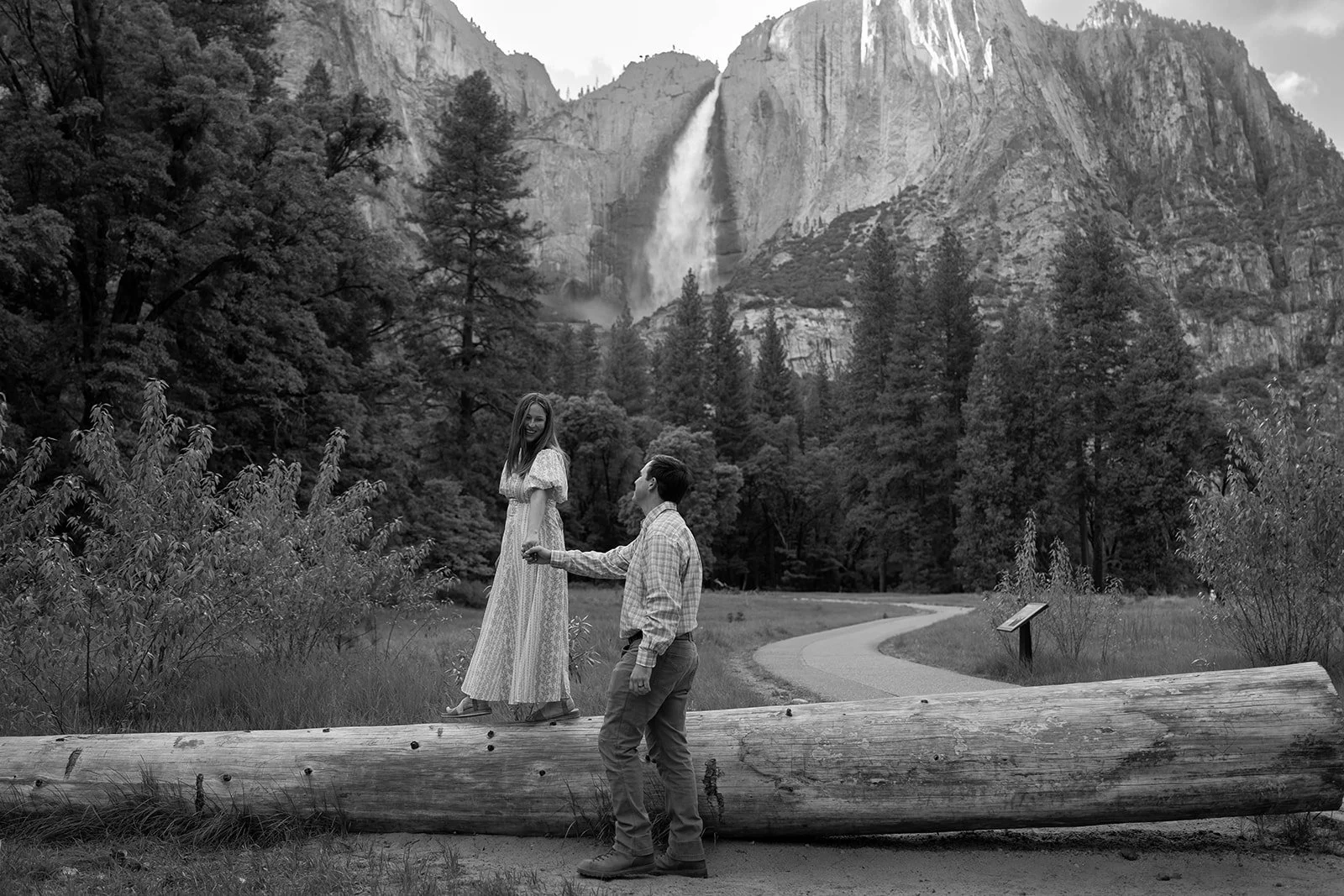 Man and woman hold hands in Yosemite National Park