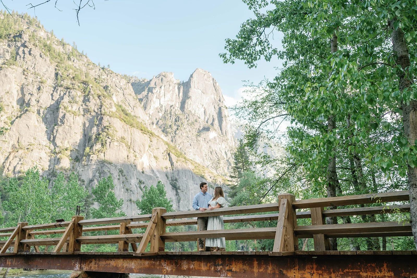 Man and woman on a bridge during El Capitan Meadow photo session