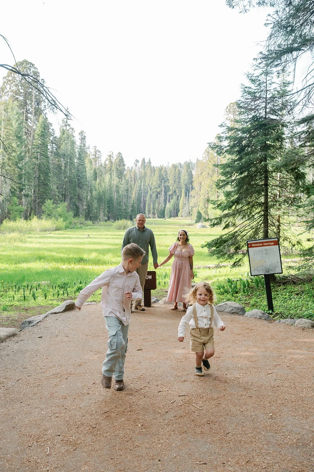 Children run in Sequoia National Park during family photos