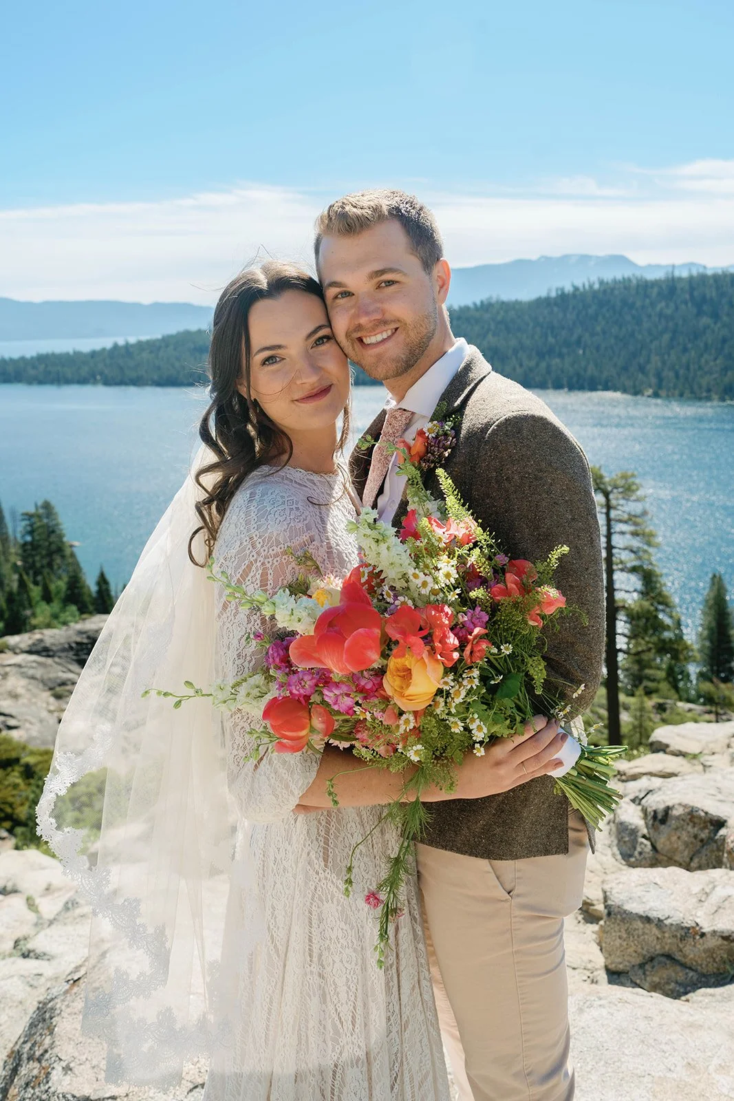 Bride and groom smile at their Emerald Bay elopement