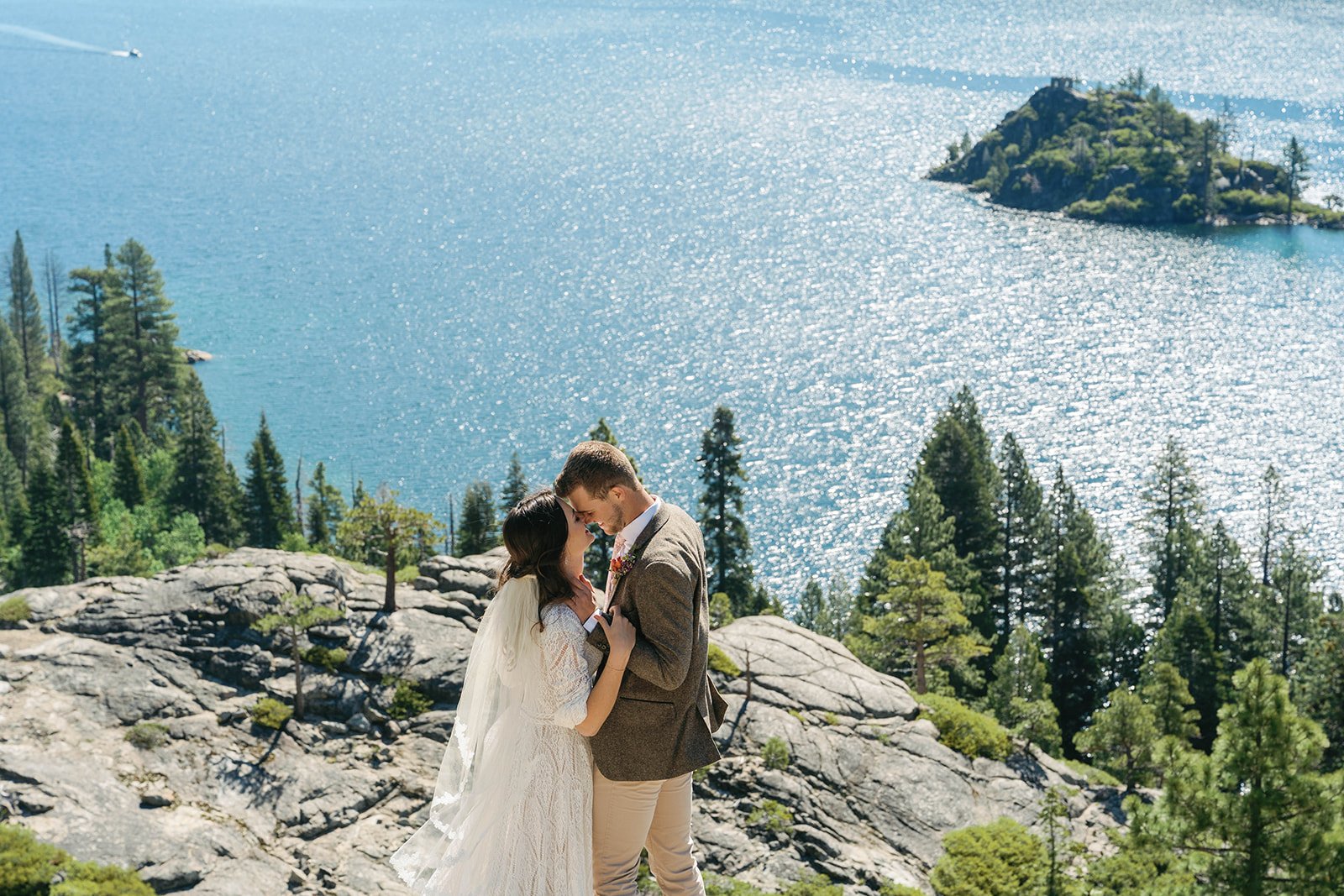 Bride and groom embrace at their Emerald Bay elopementt