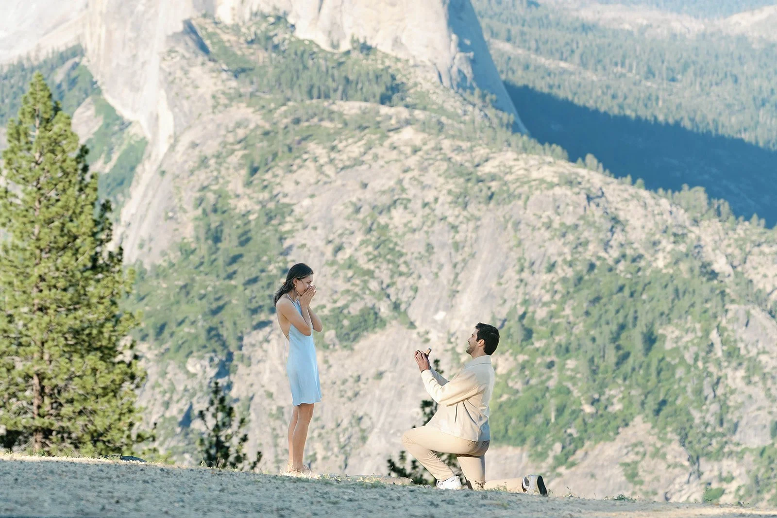 Man on one knee at Glacier Point proposal