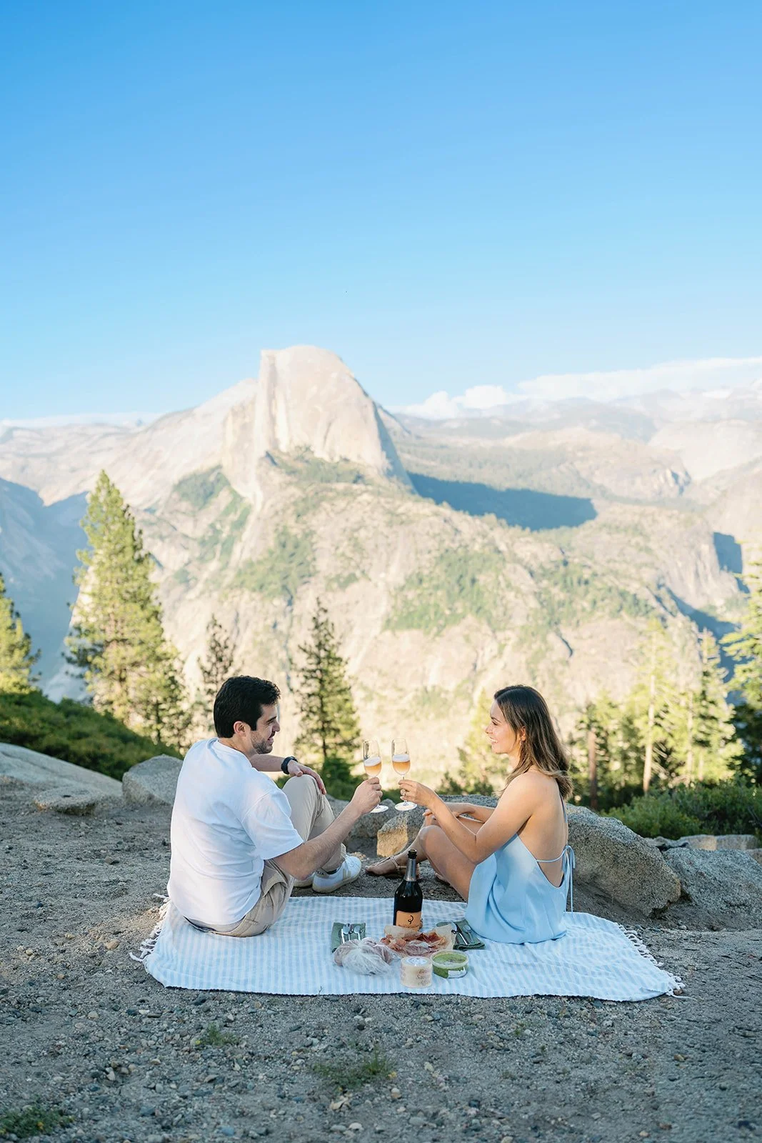 Couple at picnic after their Glacier Point proposal