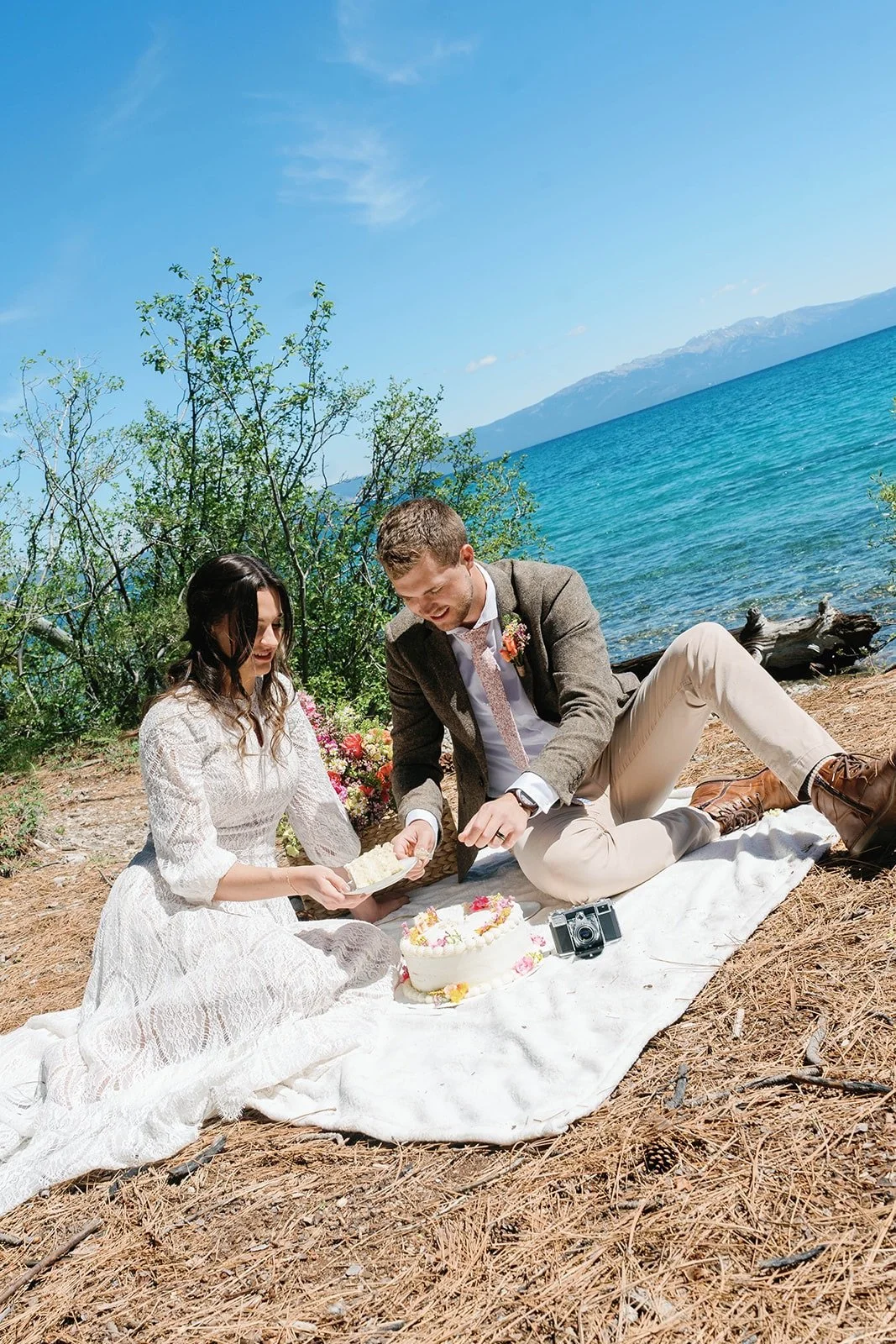 Couple cuts wedding cake at their adventure elopement