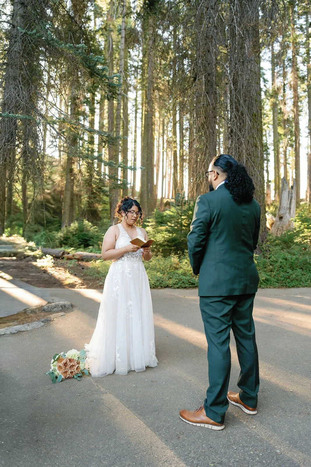 Bride and groom read vows at their intimate Sequoia elopement