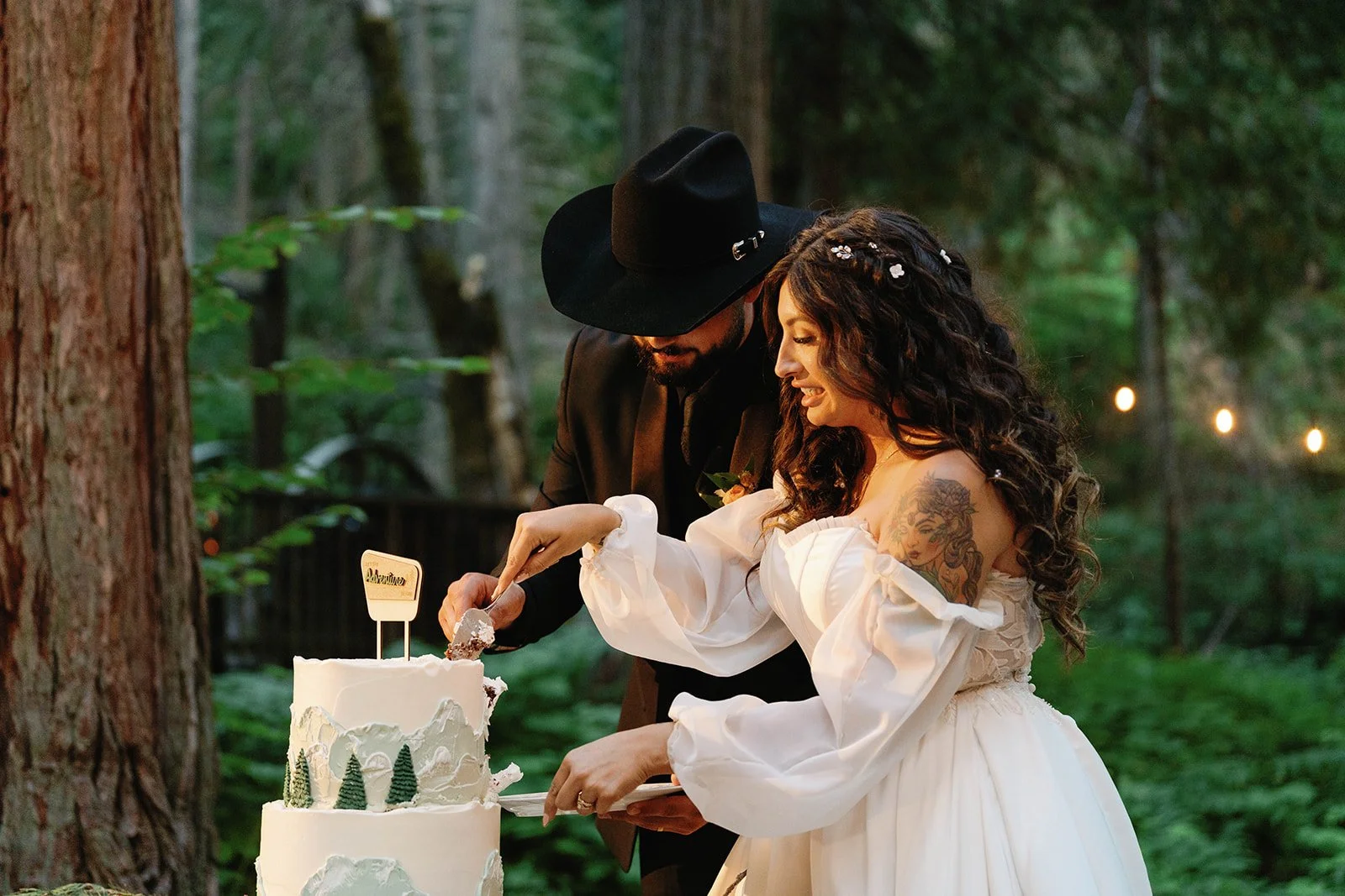 Couple cuts cake after their Glacier Point wedding ceremony