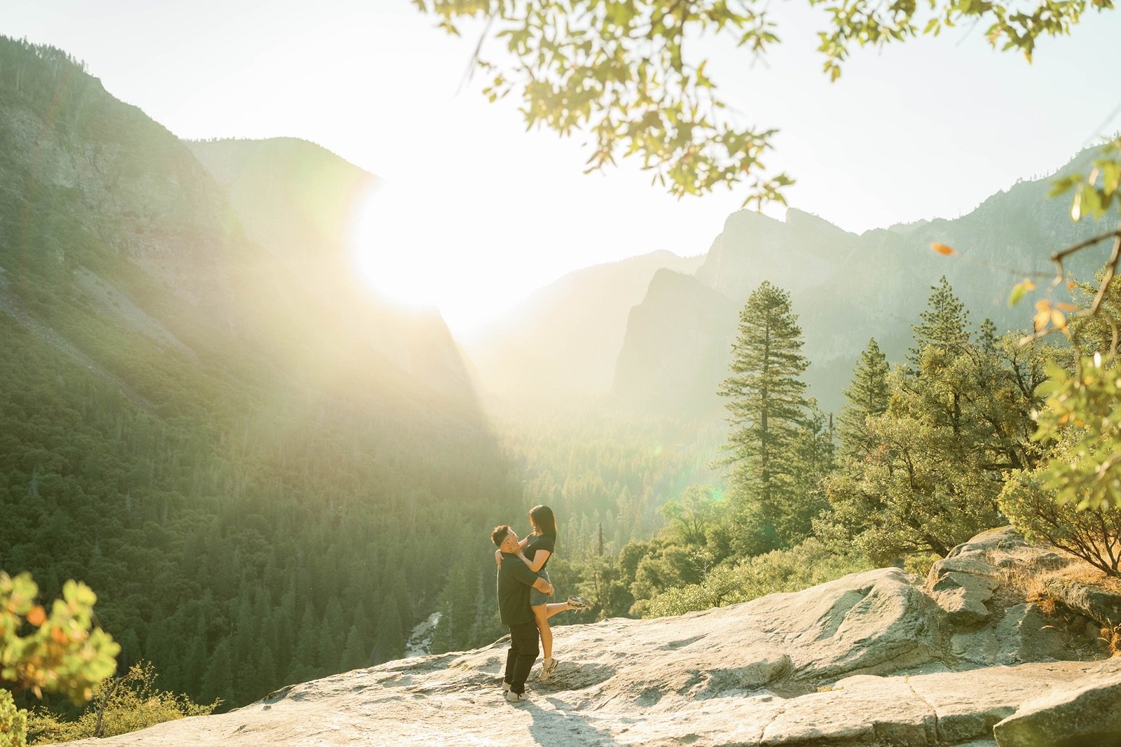 surprise proposal at at tunnel view in yosemite valley with adventure couple