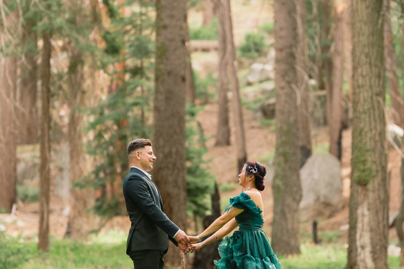 Couple holds hands at their 5-year vow renewal in Sequoia