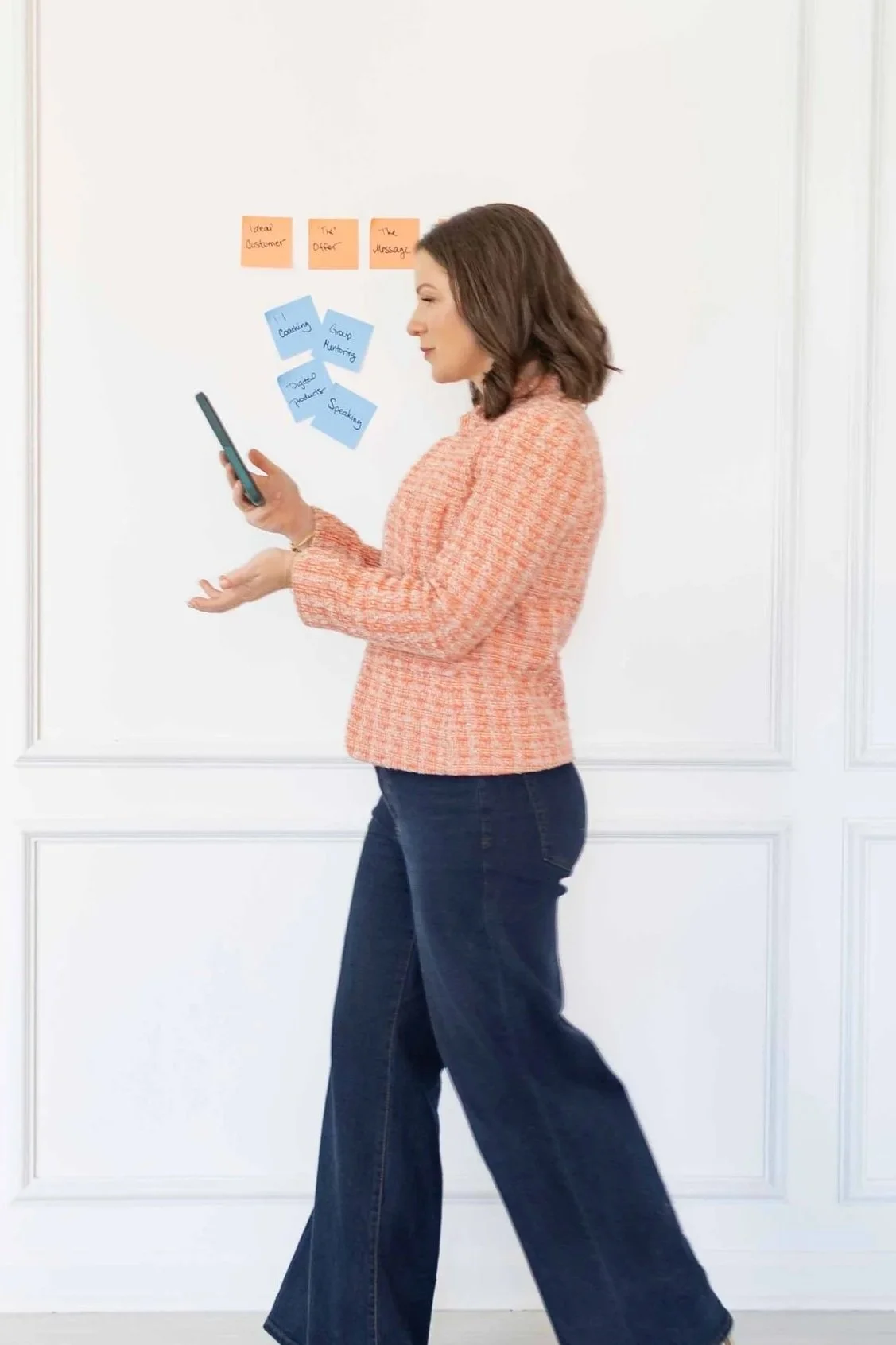 marketing strategist walking with phone