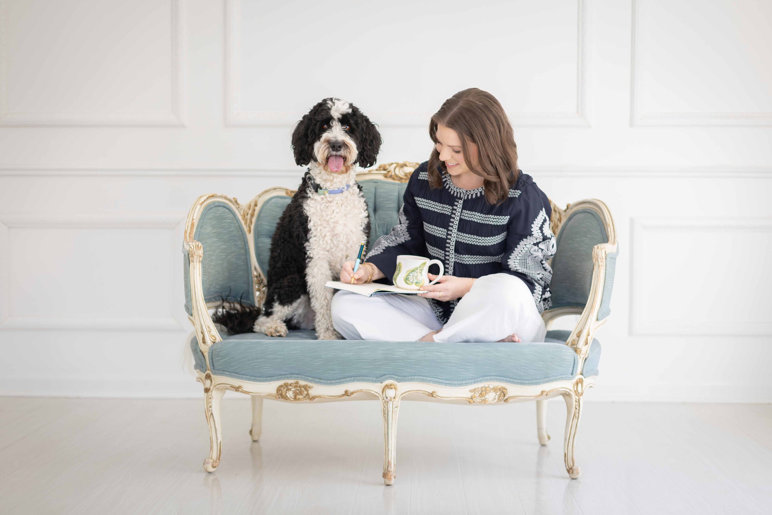 Female Founder Working with Bernedoodle