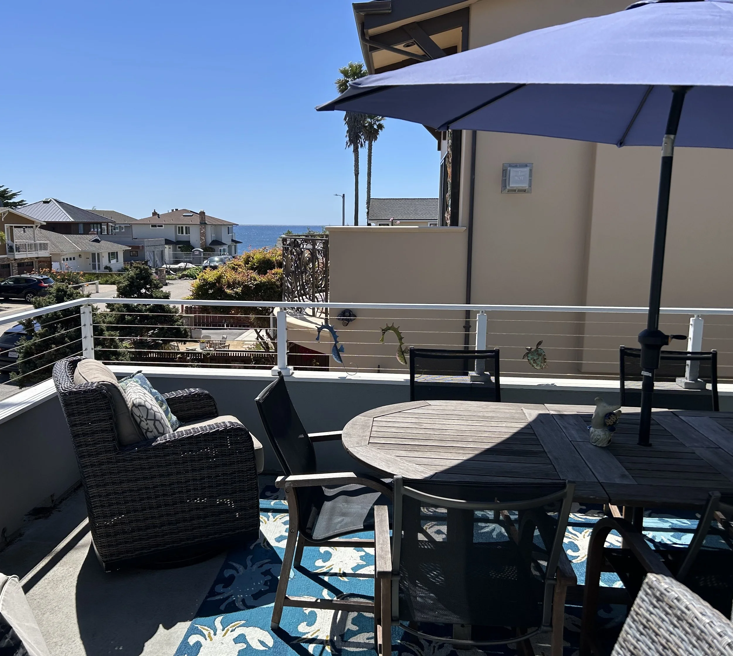 Deck off of the living room with a lovely ocean view.