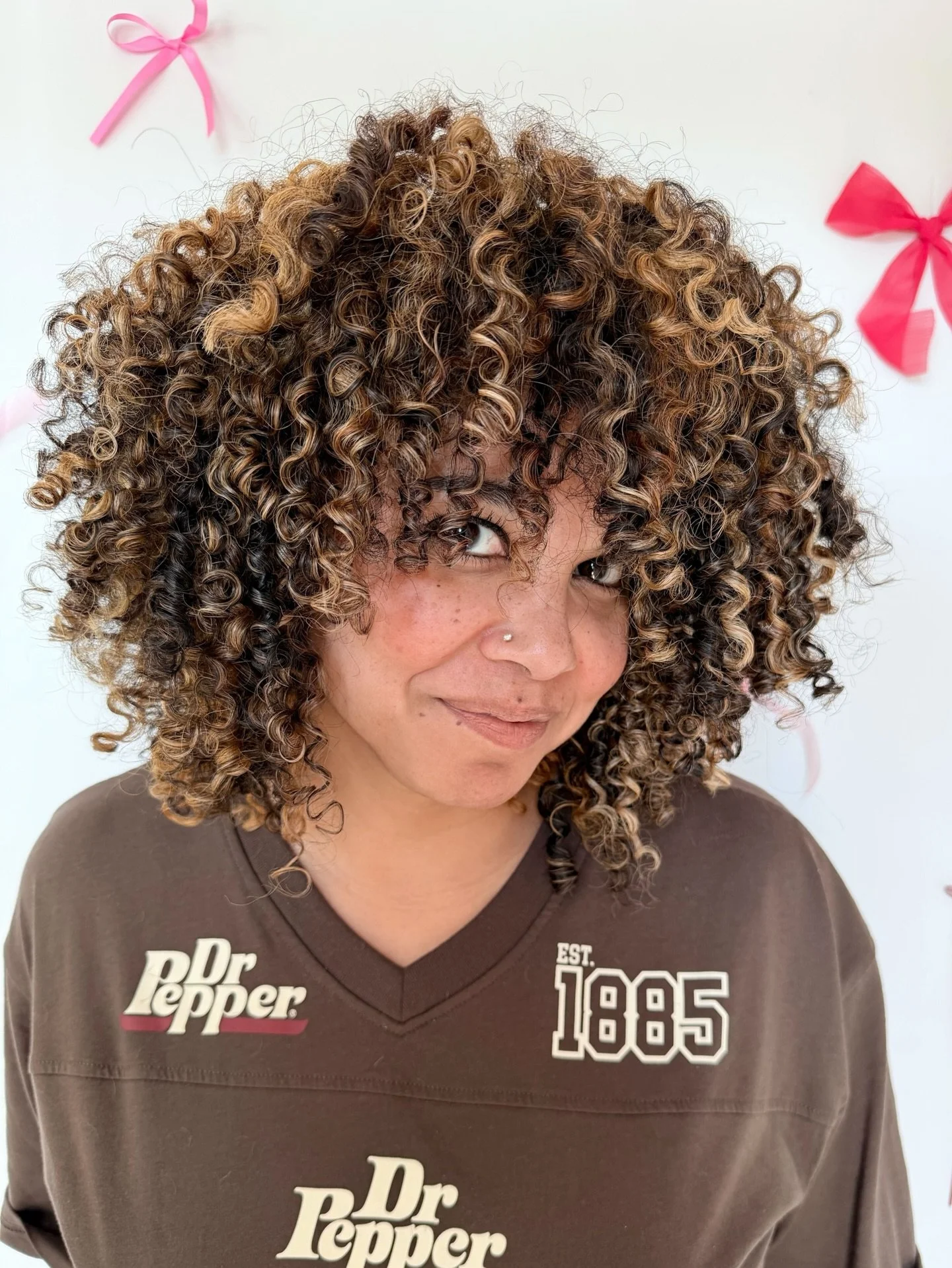 IN LOVE with this multi-tonal color! 

we kept some of her natural, dark brunette, and added long ribbons of blonde and warm copper to create depths, brightness, and movement with her curls. The placement keeps everything soft and blended, so this co